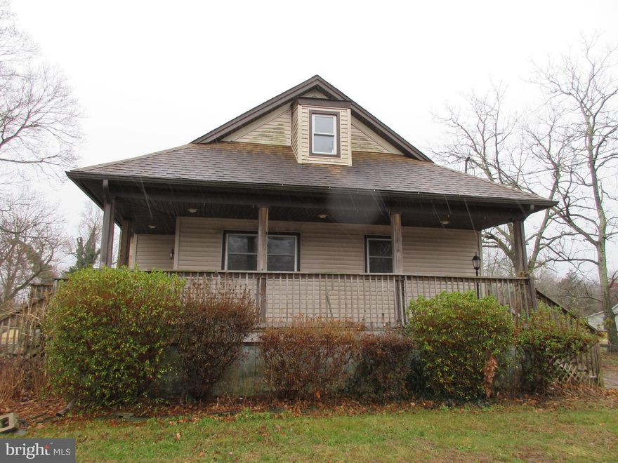 Don't miss this opportunity to make your dream home a reality on a sprawling 1-acre lot in Millville. This spacious 3 bedroom, 2 bathroom residence perfectly blends classic charm with functionality, offering generous indoor and outdoor living spaces. The home has a full wrap-around porch and deck, perfect for relaxing and entertaining. The backyard is already cleared out, providing a blank canvas for your outdoor vision. Inside, the large and inviting living room is anchored by a cozy wood-burning brick fireplace. The huge, separate kitchen provides ample space for cooking and gathering. For additional living space, there is a dedicated family room at the back of the house, complete with sliders leading directly to the deck. Convenience is key with a separate laundry room on the main floor. The thoughtful layout offers excellent flexibility with two comfortable bedrooms and one full bathroom featuring a relaxing jacuzzi tub. The second Floor is dedicated to the massive Primary Bedroom, complete with a separate adjoining room that can serve as a large walk-in closet or a private sitting area. The property also includes a full basement for storage and a double driveway for ample off-street parking. This prime location offers easy access to shopping, transportation, and schools. Come see the endless possibilities this home offers!