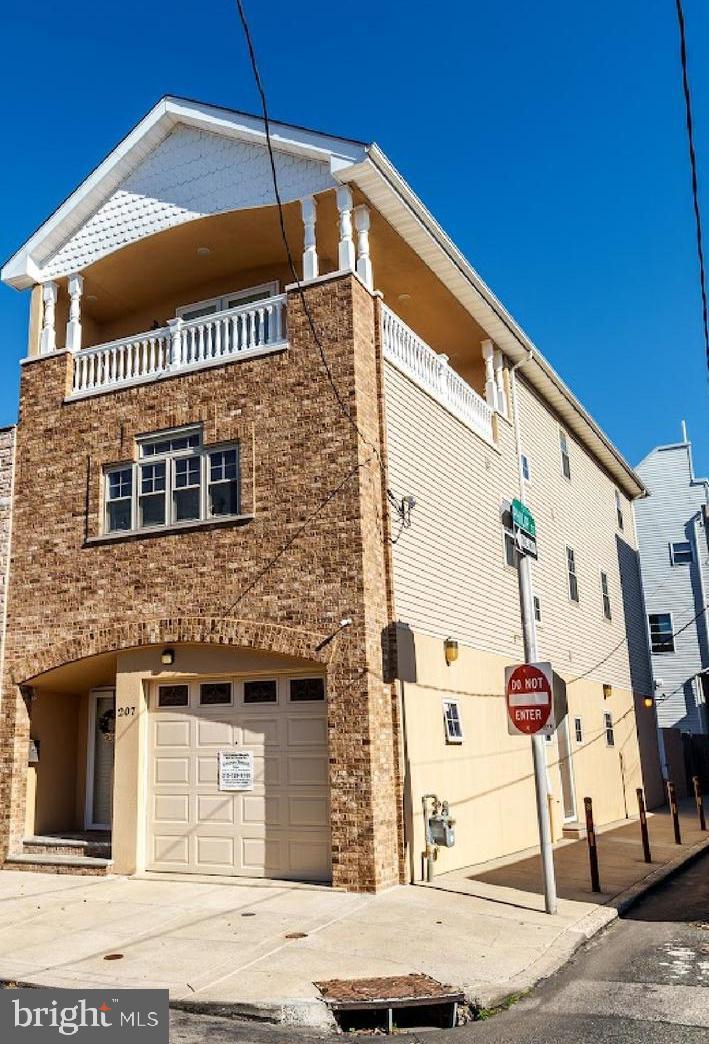 An exceptional new listing awaits in the vibrant Pennsport neighborhood of Philadelphia.
This newer constructed, custom-designed corner residence stands as one of the largest
homes in the area, offering over 5,000 square feet of luxurious living space. Crafted from
the ground up, this home is a testament to modern construction and thoughtful design.
Positioned on an expansive 77-foot deep lot with a rear width of 25 feet, the home features
four bedrooms and 2.5 bathrooms. It offers three separate entrances for enhanced
convenience and privacy, abundant natural light through its numerous windows, and a
wraparound balcony that provides delightful outdoor spaces with panoramic views. The
secure garage parking accommodates high ceilings and ample storage, adding to the
home's appeal.
Upon entering, you're welcomed into a fabulous and spacious foyer that leads seamlessly
into an open-concept living room, dining room, and kitchen area. This 25-foot wide space
boasts beautiful solid wood floors and soaring high ceilings. The kitchen is a chef's dream,
featuring 42-inch solid wood cabinetry, an expansive breakfast bar, stainless steel
appliances, and a side buffet/computer station with two large pantries. This level also
includes a convenient powder room, a huge garage with abundant storage options, and a
private outdoor space perfect for relaxation or entertaining guests.
The second floor offers a spacious hallway leading to three generously sized bedrooms,
each with excellent lighting and ample closet space. The floor is completed by an
expansive full bathroom and a separate laundry room for added convenience.
The third floor epitomizes luxury with an incredible master suite that provides direct access
to the wraparound balcony. This sanctuary includes a second living/sitting room complete
with a kitchenette, and a remarkable full bathroom featuring a dressing area and two huge
walk-in closets.
The basement presents incredible flexible space with great ceiling height, offering endless
possibilities such as a gym, family room, or home theater.
Constructed by the builder as a primary residence, this home was intended as a forever home, not
a build-and-flip. Modern utilities include a two-zone heating system, two water heaters,
and 200 amp service, ensuring efficient and reliable utility management.
This well-built home exemplifies quality craftsmanship and is ready to provide comfort and
luxury to its new owners. Don't miss the opportunity to make this one-of-a-kind Pennsport
gem your forever home.
