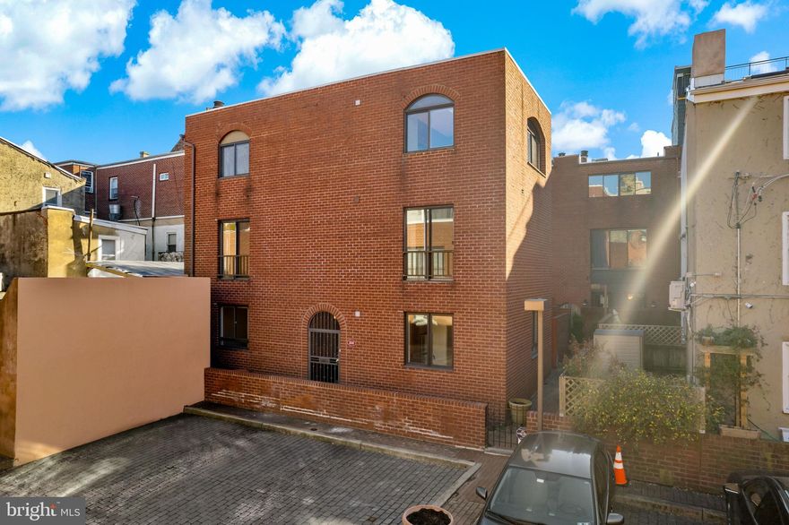 Meticulously maintained by the owner for over four decades, this rare and exceptional free-standing residence, within a quiet gated community, offers a level of privacy seldom found in the city. Distinguished by a meticulously crafted brick half-wall that graces the entire front facade, this property boasts a dedicated secured private parking space and a generously-sized garden spanning the width of the home, creating a true urban oasis. The third-floor sunroom, adorned with a skylight, exposed brick, and expansive arched windows, floods the space with an abundance of natural light. This home offers three bedrooms, 2.5 baths, and the potential for a finished basement. Whether you're ready to move right in or use it as a blank canvas to create the home of your dreams, this property offers endless possibilities. Savor the culinary delights of the neighborhood, from the charming Pizzeria Stella to the iconic Famous 4th St Deli, or elevate your dining experience at the renowned Zahav. Enjoy seamless access to public transportation, the top-rated Meredith School, world-class healthcare facilities, celebrated cultural venues, and a diverse culinary scene. Don't miss this rare opportunity to own a unique piece of Queen Village living in Philadelphia.