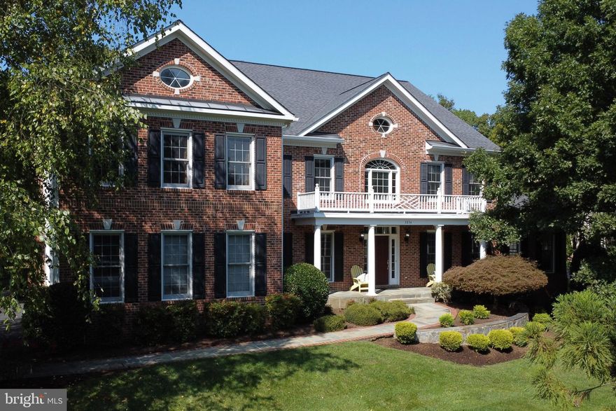 Open House CANCELLED- Accepted Ratified Offer.  This distinguished colonial residence, set against over 300 acres of protected parkland, offers a peaceful retreat within the prestigious Virginia Run community, known for its exceptional amenities. Built by Craftmark, the expansive Oakton model includes multiple builder bump-outs, offering nearly 7,858 square feet of exquisitely finished living space. A grand approach begins with stone monuments framing the driveway, leading to a slate walkway through meticulously landscaped grounds. The stately brick-front facade is complemented by a welcoming front porch, ideal for enjoying the beauty of the professionally designed landscape. Upon entering, guests are greeted by a soaring two-story foyer, highlighted by a dramatic staircase and an elegant chandelier with motorized hoist. Rich oak hardwood floors grace the freshly painted main level, where an office with custom built-ins and a formal living room with intricate crown molding offer timeless elegance. The adjacent sunroom, featuring cathedral ceilings, fills the home with natural light. A columned entryway leads to the formal dining room, beautifully appointed with crown molding and chair rail. The expansive gourmet kitchen showcases maple cabinetry, sleek black granite countertops, a central island with breakfast bar seating, a walk-in pantry, and newer stainless steel appliances. The adjacent morning room, wrapped in windows, provides access to the rear patio, while the inviting family room features soaring 11-foot ceilings, a striking floor-to-ceiling brick gas fireplace, and new carpeting. A convenient mudroom off the three-car garage and a powder room complete this level. Upstairs, the palatial primary suite offers a tranquil sitting area with vaulted ceilings, a 30-foot-long bedroom with cathedral ceilings, and two spacious walk-in closets with custom organizers. The spa-like primary bath features dual vanities, a soaking tub, a separate shower, and a private water closet. Bedrooms two, three, and four each have walk-in closets, private en-suite baths, and new carpeting. A large laundry room, with a walk-in closet, offers the potential for conversion into an additional upper-level bedroom.  The fully finished lower level is designed for entertainment, offering a recreation room, game room, media room with theater seating, projector, and screen, as well as a sixth bedroom and full bath. The walk-up stairwell provides easy access to the rear yard. Two unfinished storage areas offer ample space for a future gym, craft room, or additional storage. Outdoors, two beautifully curved paver patios overlook the expansive, flat rear yard, offering commanding views of lush woodlands, creating an ideal setting for outdoor gatherings or quiet moments of reflection. Virginia Run offers a wealth of amenities, including a community clubhouse, swimming pool, tennis, pickleball, and basketball courts, a playground, a pavilion, and scenic walking trails. The neighborhood thrives on an active and social atmosphere, with frequent events that foster a strong sense of community spirit. Seasonal gatherings such as summer pool parties, holiday festivals, and community-wide garage sales bring residents together, enhancing the friendly and close-knit environment.