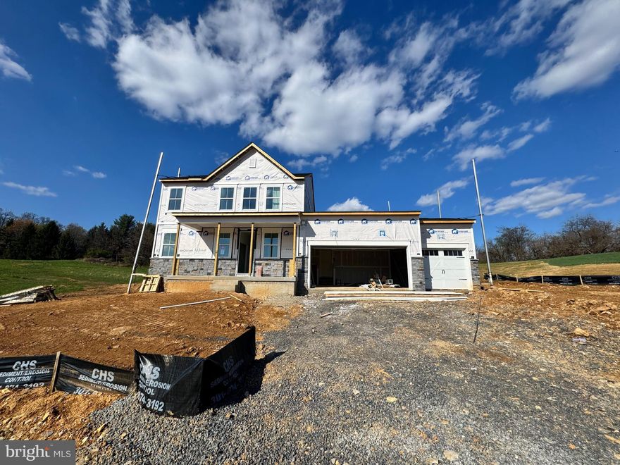 Under Construction - to be completed in May 2025!  Welcome to Estates of Tuscarora, a brand-new community offering 1+ acre homesites within close proximity to commuter routes, shopping, parks, and Historic Downtown Martinsburg! The Caspian on Homesite #1 is a 2-story colonial home with the Primary Suite on the MAIN LEVEL with a home office, and secondary bedrooms upstairs. Situated on 1.45 acres, this 3-car garage, 4-bedroom, 3.5 bath home blends timeless Farmhouse interior design with modern convenience! Offering an open floor plan, this home is perfect for both comfortable living and entertaining. At the heart of the home is an inviting family room with a stone gas fireplace, seamlessly connected to the kitchen and casual dining area. The well-appointed gourmet kitchen features GE Profile Stainless Steel appliances with range, hood vent, built-in wall oven and microwave and counter depth refrigerator; complete with a spacious island with quartz countertops, and a farmhouse sink.   Imagine unwinding on the covered deck, a perfect outdoor retreat designed for relaxation and enjoyment, whether sipping your morning coffee as the sun rises, hosting a summer barbecue, or cozying up with a book during a gentle rain, this versatile space offers endless possibilities. This home is a perfect blend of charm, functionality, and space, designed to meet all your needs. Don’t miss the opportunity to make this remarkable home your own! Call and schedule your personalized appointment today! Ask about our EPIC SAVING S PROMOTION with the use of KHovnanian American Mortgage! **Some photos are virtually staged renderings and may not reflect current home finishes. Pricing and promotions are subject to change without notice.  See Sales Consultant for more information**