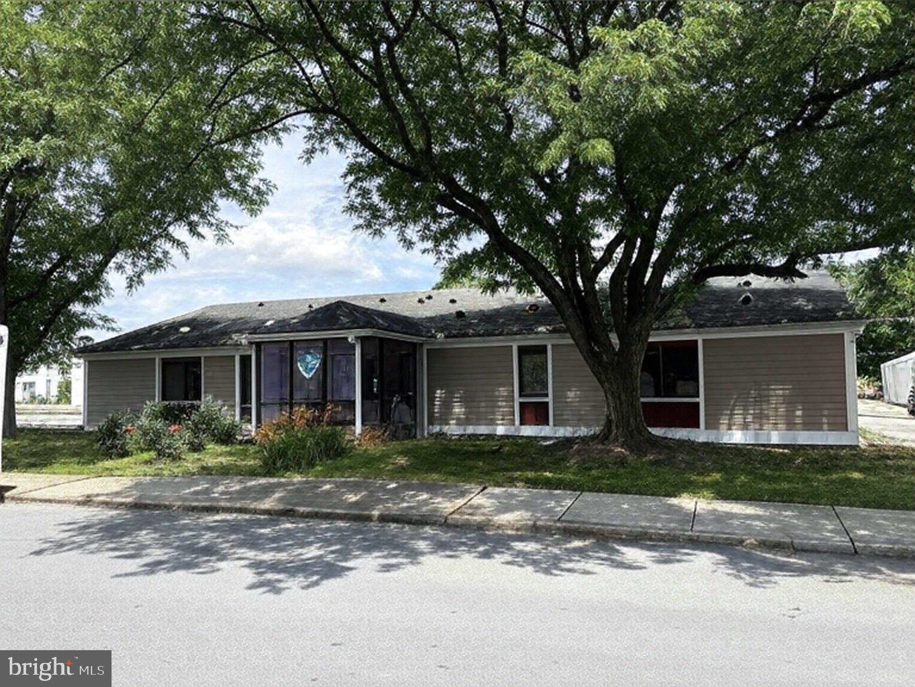 Remodeled 4,500-square-foot professional/medical office building on nice 0.51-acre corner lot in Chambersburg Borough. The single-tenant building is vacant and ready for immediate possession. The layout is suitable for professional, medical, daycare, non-profit, institutional or other creative commercial uses. Totally remodeled in 2015, the building exterior is a mix of block, cement board, and stucco with well-appointed, modern office finishes. The layout features a lobby with reception office, three conference rooms, a kitchenette, three restrooms, and 13 perimeter private offices . HVAC is provided by electric heat pumps. The building is equipped with solid wood core doors, a security system, automatic lighting, and keypad entry. The site is strategically located 0.50 miles south of Downtown Chambersburg. This is a downtown mixed-use setting with easy access to WellSpan Hospital (+/- 1 mile east) and Interstate 81. The property is zoned Distributive Commercial Neighborhood which allows a variety of commercial uses by right. Access to the site is from South Main Street or East McKinley Street. The building is flanked by two (2) parking lots (+/- 30 spaces). Site improvements include electronic business signage along Main Street, concrete sidewalks, and exterior lighting. Roof mounted solar panels reduce electric utility cost. Seller financing is available. Owner is a licensed Real Estate Salesperson in PA.