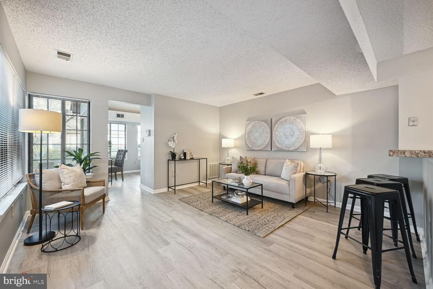 Don't wait to view this beauty in move in condition. All one level. Open floor plan, freshly painted, new luxury vinyl plank flooring throughout.  Use as a 2 bedroom or 1 bedroom and den. Enjoy walking straight into your kitchen from your integral garage. No more getting rained on as you bring groceries into your home.  Washer/dryer in the condo.  A super cute front covered patio . No FHA.  A perfect place to call home. 2nd chance for lucky buyer. Previous offer fell through.