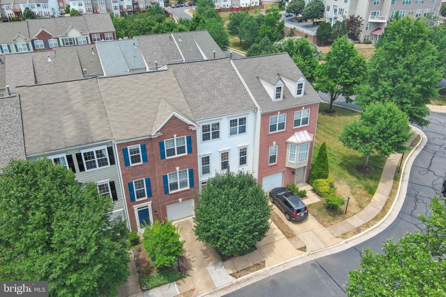 Note estimated square footage covers all three levels - unlike Tax Record info, all floors are above ground finished living area square footage.

OPEN HOUSE Saturday and Sunday (July 6 and 7).  Nicely refreshed in the popular and centrally located Overlook Community, close to all the new multiuse development of Alexandria West (formerly Landmark Mall area).  New durable and waterproof Luxury Vinyl Plank and Carpet installed throughout.  Fresh paint.  Kitchen updated with Bright White Quartz Countertops and undermounted sink with new Spray Combo Faucet.  New SS French Door Refrigerator with Water and Ice Dispenser, 5 Burner Gas Stove, and Built-in Microwave (2024); SS Dishwasher (2017).  New Mirrors, Plumbing, and Light Fixtures,( including all new energy conserving toilets throughout the 3.5 bathrooms).     Expanded Trex Deck off Kitchen/Family Room (2023);  Roof (2018) with limited transferrable "Lifetime Warranty";  Washer and Dryer (2020); Hot Water Heater (2015); HVAC (2012) with 20 year warranty on heat exchanger.

Enjoy two oversized primary suites on the third floor, one with trey ceiling detail, dual vanity, new glass shower door, water closet, separate soaking tub and walk in closet; the secondary primary suite has a wall of closets and a linen closet inside the attached bathroom.  The main level features two separate, but flowing living areas.  One is a kitchen with eat-in space plus plenty of space for conversation/family room area.  Adjacent is the formal dining room (with ceiling detail) and living room.  The entry level first floor has a family room with cozy gas fireplace, the 3rd bedroom/bonus room, a full bath, and a spacious one car garage with driveway parking.  Light filters into all the spaces - a bright unit with windows throughout.