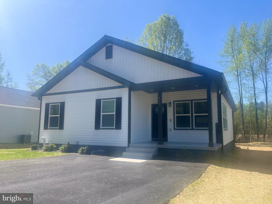 BRAND NEW HOME UNDER CONSTRUCTION–  This beautiful single-level home features 3 bedrooms and 2 full baths on one level with a modern, open layout. Enjoy luxury vinyl flooring throughout the house, tile in the bathrooms, and a stylish kitchen with stainless steel appliances , recessed lighting ,and pendent lights over the peninsula  , 40" tall white cabinets, and granite countertops. The living room offers a modern electric fireplace with shiplaps accent walls and a mantel ,creating a stylish focal point . Laundry room has a built in shelving with a seat. Step outside to a deck with stairs leading to a concrete patio, perfect for outdoor living and entertaining. A private driveway provides easy parking. Located just minutes from the Town of Colonial Beach, you’ll enjoy both the tranquility of the neighborhood, and a water oriented community with beach access  as well  boating access. If you're searching for your first home or looking to purchase a second property ,this beautiful and affordable new construction is an excellent opportunity to enjoy modern living just minutes from the water. Placid bay Civic Association is voluntary.Pictures are from a previous home , new pictures coming soon.