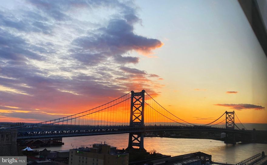 CROWN JEWEL OF PHILADELPHIA, UNBELIEVABLE & UNRIVALED VIEWS - BEST OF CITY SKYLINE, DELAWARE RIVER AND BEN FRANKLIN BRIDGE VIEWS. WAKE UP EVERY MORNING TO SUNRISE OVER BEN FRANKLIN BRIDGE AND END THE DAY WATCHING THE SUNSET BEHIND THE CITY. LARGEST PRIVATE ROOFTOP TERRACE IN CITY WITH 1,800 SQ FT DIRECT elevator access into the unit, magnificent 3 BR luxury condo with open, spacious layout, in Old City's premiere boutique building, only 30 units. 2,700 square feet of living space with so many upgrades it is almost impossible to count. Soaring 10-foot ceilings with oversized floor to ceiling windows throughout, best views of sunrise and fireworks in the city. Grand entry with dimmable lighting in drop down ceiling to add dramatic appeal. Gorgeous, custom wide plank oak flooring in warm caramel color. Oversized gas fireplace in living room with custom cabinetry for audio visual system. Whole house audio system including roof terrace speakers and balcony ceiling speaker. Lutron automated custom blinds and lighting system throughout house. Large balcony off of the living room with water and city views. Relaxing and intimate space with Trex finished flooring. This luxurious condo features 4 full beautiful limestone baths with Kohler fixtures, Duravit sinks plus a powder room. The master bedroom has unreal views of Ben Franklin Bridge and skyline plus custom blackout blinds.  Master bathroom is luxuriously spacious with radiant heat in floor, double sinks, spa-like soaking tub and oversized shower. Master closet has custom woodwork with floor to ceiling storage.  Custom metal hang bars by Veyko Metals. Dream kitchen for anyone that enjoys cooking and entertaining. Oversized black granite island, two stainless steel sinks with perfect drain feature, SubZero 42 inch side by side refrigerator/freezer, Sub-Zero, 78 bottle wine unit w/ 2 refrigerator drawers, Wolf, 48 inch Dual Fuel Range with 2 convection ovens and 6 burners plus 11 inch char broiler Best by Broan 48 inch Vent Hood & Blower to accommodate ventilation for gourmet stove, Stainless steel backsplash, 2 Fisher & Paykel Dishwasher Drawers, 2 extra HP garbage disposals, Custom oversized cabinetry with large pull outs. Reverse osmosis water filtration system and upgraded KWC faucets. Bedroom 2 features custom-built queen-size platform bed with 3 large capacity storage drawers.  Wall is finished with gorgeous gray ostrich leather panels.  Luxury lotus flower accent wall covering. Sheer drapes on ceiling track offer privacy when door is open. Custom 3form sliding closet door offer soft backlight to finish the attention to detail. Bedroom 3 can also be used as office or den. Pocket door separates room from living area for use as bedroom with full bathroom and finished closet. Wall mounted Stark toilet keep the bathroom modern and spacious. First floor powder room with Stark wall mounted toilet and custom sink. Custom metal and glass partition for privacy from main living area. Custom railing by Veyko Metals on open staircase to access private roof terrace. Full bathroom at roof level with Grohe rain showerhead and Duravit toilet. Dedicated laundry room with the Rolls Royce of full-size washer and dryer plus trash chute in the unit. Custom cabinetry and black granite counter.  Oversized 80 gallon water heater. Whole house water filtration system with water softener.Pocket doors throughout for space saving appeal. Roof terrace has natural gas line for grilling. Roof storage closet and 13 wide x 5 deep x 10 high. Roof has water supply lines, waste and drain lines and electrical sleeve stubbed out for possible future use.  Deeded covered parking spot steps away from door in gated parking lot, and New Daikin HVAC roof level, Doorman/concierge on site. Quiet, residential block. Old City has the best restaurants, coffee shops and shopping. Hidden gem. Schedule your private tour today at one of the premier luxury buildings in all of Philadelphia! Matterport video walk through available!