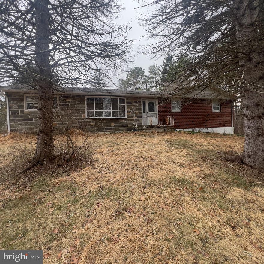 Nestled in the heart of the Pocono Mountains, this cozy 2-bedroom, 1-bath rancher sits on 2 serene acres, offering peace and privacy. Featuring a walkout basement and an attached 1-car garage, this home is brimming with opportunity. With some TLC, it’s perfect for owner-occupants looking to build sweat equity, fix-and-flip investors, or buy-and-hold investors. Don't miss this chance to transform a hidden gem into your dream retreat or next profitable venture!

Sold in as-is condition. Buyer responsible for covering 2% transfer tax.  Contact co-listing agent for more information.