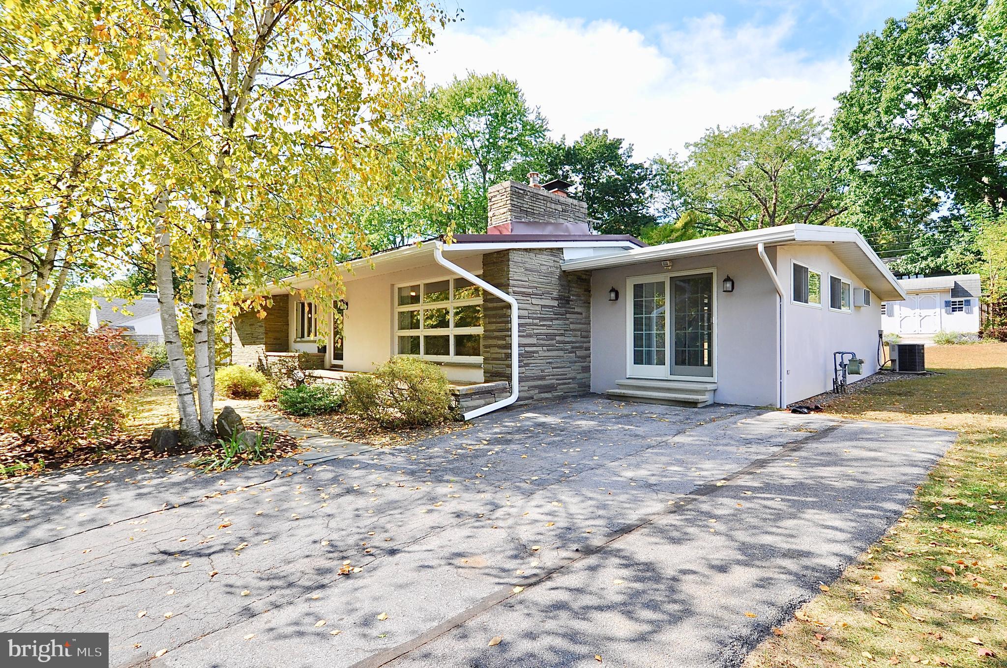 Wonderful stone and stucco ranch home with mid-century modern flair located on a quiet street in the State College Boro minutes from downtown State College and Penn State University. This light filled home offers the ease of one-level living, hardwood floors throughout the main level, stone fireplace from floor to ceiling in the living room with cathedral ceilings. Enjoy the large family room with gas fireplace and new skylights with remote shades. The partially finished lower level includes a laundry area, full bath, and large storage closets. Outside enjoy the private back yard with large storage shed for additional storage. New rubber roof and skylights, all new gutters and down spouting, new chimney flashing and new 200 ampere electrical panel. Heat pump has natural gas backup for those really cold days. This property has a current rental permit for 3 unrelated non-student. Listing agent is a licensed PA Realtor.