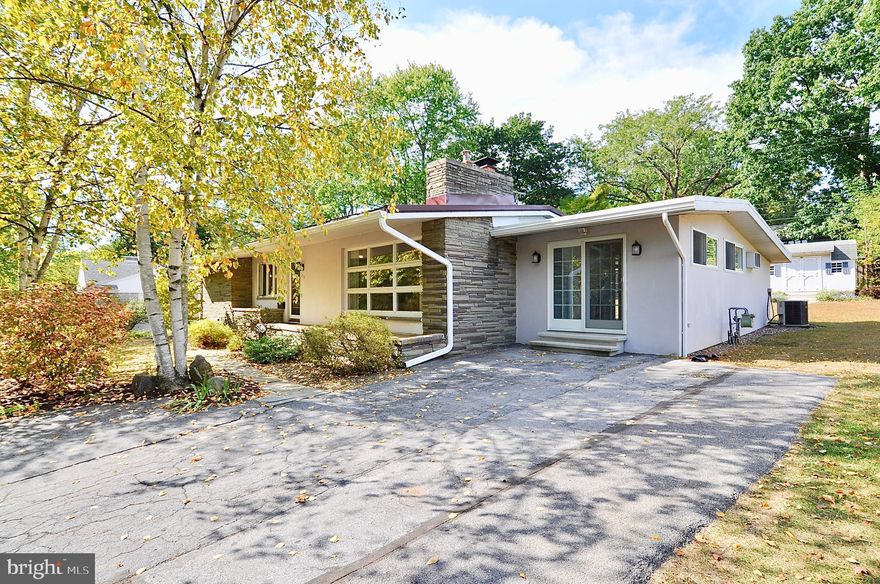 Wonderful stone and stucco ranch home with mid-century modern flair located on a quiet street in the State College Boro minutes from downtown State College and Penn State University. This light filled home offers the ease of one-level living, hardwood floors throughout the main level, stone fireplace from floor to ceiling in the living room with cathedral ceilings. Enjoy the large family room with gas fireplace and new skylights with remote shades. The partially finished lower level includes a laundry area, full bath, and large storage closets. Outside enjoy the private back yard with large storage shed for additional storage. New rubber roof and skylights, all new gutters and down spouting, new chimney flashing and new 200 ampere electrical panel. Heat pump has natural gas backup for those really cold days. This property has a current rental permit for 3 unrelated non-student. Listing agent is a licensed PA Realtor.