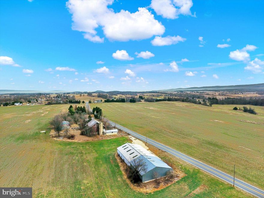 102 acre Farm with approx. 80 acres very productive Hagerstown Silt Loam soil, home w/ 2 separate living units, 50'x74' Bank Barn, 60'x130' Building with concrete floors, 30'x40' Equipment building, 32'x40' detached garage. The farm is zoned R-1 (Low Density Residential) with approx. 4,000 ft of road frontage, public water & sewer is very close by. Approx. 1/4 mile from Green Twp Park. Great location for a residential development, poultry or dairy operation. Approx. 1.5 miles from RT 81 and close to RT 76 & RT 30. Settlement requirements: no more than a 90 day settlement, no development due diligence