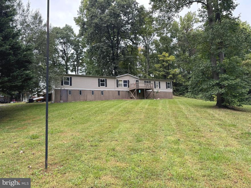 Great investment opportunity.    This double wide sits on a beautiful 2.21 acre lot.   This house features 4 bedrooms and 2 bathrooms.   Don't miss this opportunity.   Also featuring a shop/storage building in the back.