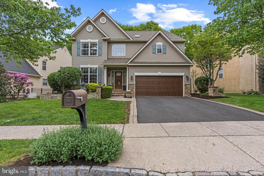 Welcome to 116 Riverwoods Drive where thoughtful design meets an unbeatable location in New Hope, Pa.  A two-story single-family residence that stands as a testament to luxury living. The location is a rare find — tucked inside the Riverwoods Community, you’re steps from the charm of New Hope and Lambertville, yet the backyard opens to quiet woods awaiting many adventures from hiking to creek exploration or a simple walk to town. This property, characterized by its exquisite design and the use of top-tier materials, is maintained in superb condition, offering an unparalleled living experience. The kitchen serves as the heart of this residence, meticulously appointed with stainless steel appliances and a double oven, catering to both culinary enthusiasts and large-scale entertaining. A grand island, featuring an integrated sink and expansive counter space, anchors the room, complemented by sophisticated stone counters and a distinctive stone wall. The custom range hood adds a refined architectural element.  The kitchen is a genuine showpiece — practical details, countless custom nooks and drawers, a large pantry, and a separate breakfast area make it as functional as it is beautiful, completing this thoughtfully designed space. The living room offers an atmosphere of refined comfort, distinguished by its 20+ foot high ceilings and elegant wall of windows bringing the privacy of the outside in.  The stone gas fireplace and wide plank hardwood flooring throughout, together create an expansive and inviting environment. 
The primary suite offers a true sense of relaxation — vaulted ceilings, dual walk-in closets with wood finish custom cabinetry, a spa-caliber bath with heated floors, frameless shower, and a jetted soaking tub; a sitting alcove overlooking the canopy of trees to complete the elevated hideaway.
The additional 3 bedrooms provide serene retreats, each benefiting from high ceilings that amplify the sense of space and light, alongside the enduring elegance of wide plank hardwood flooring. The secondary bath was built for real life — custom dual-sink vanity with pull-out steps for little ones, a fully tiled zero-threshold shower with bench, heated floors, and a skylight designed with discerning taste.  Further enhancing the property's appeal are a dedicated laundry room with ample storage and organization for convenience and an attached two car garage, offering more practical storage. Entertaining is effortless outside — a large Trex deck, a permanently plumbed gas line for grilling, and a lower level paver patio, all framed by the wooded backdrop conservancy land, on one of the most sought after lots.   The finished basement offers many options from gaming room to movie nights or extra office space, alongside a rubber floored fitness room or whatever fits your lifestyle needs. The whole-house infrastructure includes a water filtration system with softener and a whole-house generator, a newer roof, newer HVAC system and newer water heater for peace of mind. This home was built and maintained with permanence in mind — the upgrades are too numerous to capture here. A walkthrough will say the rest.  We invite you to experience the refined elegance and superior craftsmanship of this distinguished New Hope residence.
