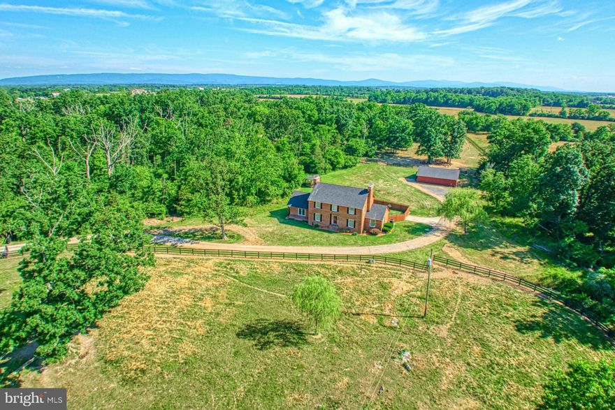 Offer Deadline Noon Tuesday June  25.,

Absolutely Immaculate!  Stunning all brick farm house located on 45 acres.   Perfect for horses  with  fences, flat acres of great grazing fields and three paddocks & a pond. Totally remodeled interior.  Freshly painted in side designer colors of Edgecomb Grey and white trim.  Kitchen  with new gorgeous white cabinets with contemporary pulls and Granite Countertops plus center island.  Breakfast Nook makes meal time super easy.  Gleaming  Hardwood floors on main level have all been sanded and refinished.  Main level den or could be a Bedroom with new Carpet.  Remodeled Half Bath with new vanity, toilet and ceramic tile floor.  Huge Living Room with  Brick Fireplace which was recently cleaned and serviced.   Hardwood floors and atrium door to rear yard and large patio. Main level also offers a really large Great Room with Built ins perfect for your library or Family Room.  Oversized Mud Room with slate tile flooring, new Washer & Dryer.   Formal Dining Room with wall trim & chandelier.  French doors to rear brick paver patio.  Upper level with 3 bedrooms , the newly remodeled Full Hall Bathroom with tub/ shower - freshly glazed. New vanity & toilet.  Gorgeous ceramic tile on floors and shower walls. Primary Bedroom was expanded by removing a wall opening the Full Primary Bathroom- all remodeled with upscale tile, countertops, lights and mirrors. Wood burning fireplace adding romance to the Primary room.  Attached luxury bath with walk in tile shower.  Rear yard with patio and privacy fence.  Best of all for the Horse Lover, is the 3 stall Horse Barn with water & electricity.   Property is currently rented to horse owners  to graze on the field.  Great location, minutes to Winchester, route 50 & 81. 
45 Acres of flat, pristine land all fenced for horses.  Three paddocks with two  automatic water stations, one out front and one in the paddock.  Rear gate off Ginns Rd 
Large tractor and other farm equipment in barn for sale.  

Pre listing home inspection completed.  Property approved for 3 UDR.  Roof replaced 4 years ago.  HVAC is 2 years old.  New dishwasher and disposal.  Home percs for 3 bedrooms.  Windows replaced.  Septic maintained.   Hurry! This farm will not last.