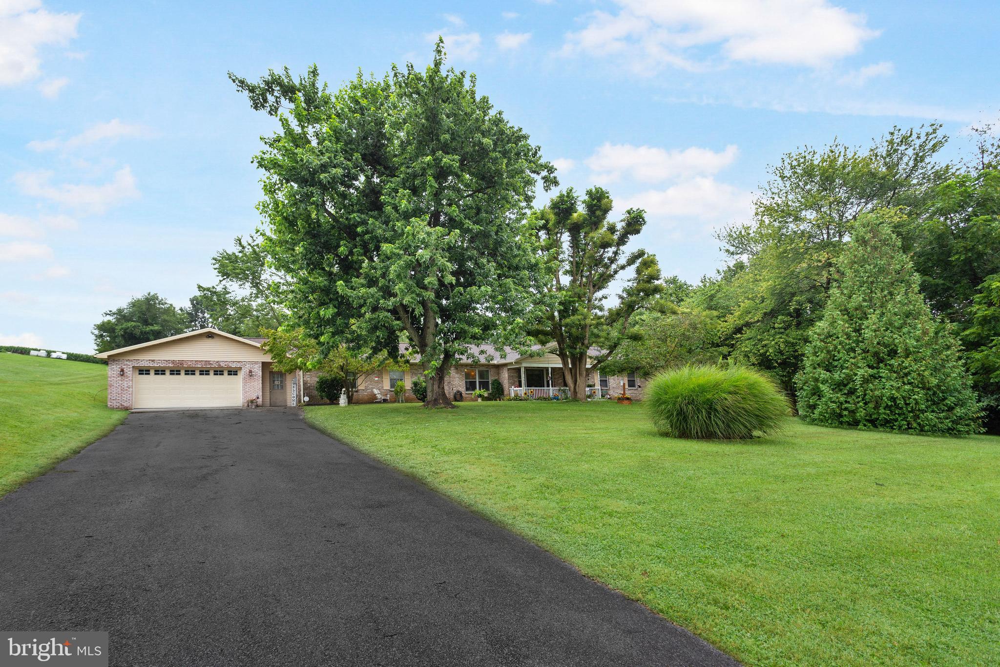 Country living at its best! Over 2 acre lot convenient to RT 83 and Maryland commuters. Solid rancher with unique features. Comfortable 1500 square foot plus additional unheated 3 seasons sunroom, huge 30x23 unheated semi finished first floor foom used currently for crafting but could be finished for additional living space, and 4 car tandem 28x45 attached garage with additional man door in the rear. Concrete patio overlooks luxurious in ground pool. Nice sized interior rooms, pellet stove for cost efficient auxillary heating, huge unfinished basement, first floor laundry/powder room. Formal living room, formal dining room and cozy family room. Covered front porch. New Roof in 2024. Tons of storage. Seller provided First American 1 year basic home warranty.