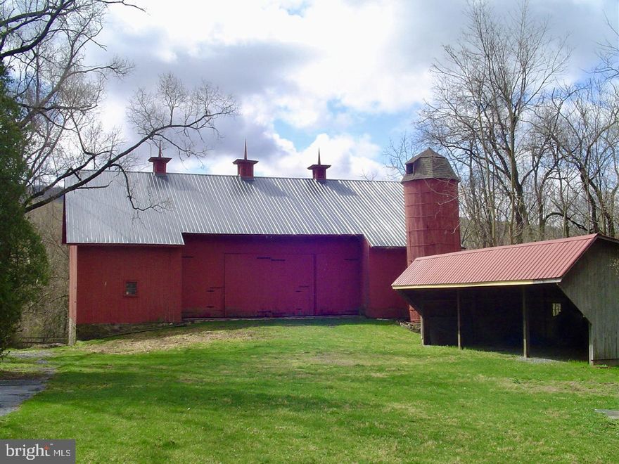 A rare opportunity to acquire an extraordinary legacy holding in Middle Paxton Township, Dauphin County known as Flemish Down LLC. This offering consists of approximately 777± contiguous acres across multiple tax parcels, featuring a unique blend of productive farmland, mature timber, mountain land, historic improvements, and approximately one mile of Clarks Creek frontage.
The property includes four residential dwellings, all currently rented. The main house located at 1231 Clarks Valley Rd is a substantial historic structure with multiple wings; the west wing ( 3 bedrooms, 2.5 baths) is rented, while the center and east wings (approximately 6 bedrooms, 3 full baths, and 2 half baths) are retained by ownership. Two of the homes include barns. Additional residences include the farmhouse at 1241 Clarks Valley Road (3 bedrooms, 1 full and 1 half bath), the Woody House at 1061 Clarks Valley Road (3 bedrooms, 1 full and 1 half bath), and the Spring House at 1250 Whitetail Lane (3 bedrooms, 2 full baths).
Beyond the residences, the property is richly improved with extensive agricultural and historic outbuildings, including approximately 12 stables, barns, an ice house, milk shed, chicken coop, workshop, silo, tractor shed, and additional support structures that reflect the property’s long agricultural heritage.
Land use is diversified and income-producing, with residential leases, farming leases, and hunting leases. The hunting leases are annual and expire June 1, 2026: the residential leases are month-to-month; the agriculture lease is partway through a five-year term and expire December 31, 2028. Portions of the forested acreage are managed under a Silviculture Plan, supporting long-term stewardship and sustainability.
Flemish Down has been held by the same family for generations, with roots dating back over a century. Historically, portions of the original holdings have been conveyed to conservation organizations and public agencies, including lands now associated with State Game Lands, public conservation, and the Appalachian Trail corridor, underscoring the property’s environmental and regional significance.
This offering may appeal to conservation-minded buyers, family real estate trusts, timber companies, and public or quasi-public entities seeking large-scale land acquisition. Marketing will include exposure in the local MLS, commercial real estate platforms, and targeted outreach to qualified private and institutional buyers.
Property consists of multiple parcels with varying characteristics, improvements, and encumbrances. Buyers are encouraged to conduct full due diligence regarding acreage, boundaries, leases, and land use restrictions. Shown by appointment only. DO NOT ATTEMPT TO ACCESS ANY PORTION OF THE PROPERTY WITHOUT AN APPROVED APPOINTMENT.