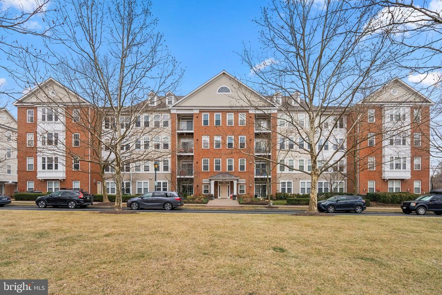 Bright & Spacious Top-Floor Corner Condo in King Farm!
This sun-filled 2-bedroom, 2-bath condo boasts a desirable top-floor corner location with abundant natural light and a thoughtfully designed floor plan.

Step inside to gleaming hardwood floors in the foyer, leading to a cozy living room with brand-new carpet and sliding glass doors that open to a private balcony—perfect for enjoying morning coffee or evening relaxation. The spacious kitchen features a breakfast nook, gas stove, and opens to a welcoming family room with a fireplace. A separate dining room provides an elegant space for meals and gatherings.

The large primary suite includes two closets—one walk-in and one reach-in—as well as an ensuite bath.

Recent Updates:
- Brand-new dishwasher
- Fresh paint throughout
- New carpet in all living areas
- All-new light fixtures

Located in a secure elevator building, this home also includes a private storage room on the first floor and convenient parking in the lot at the rear entrance.  

Prime Location & Community Amenities:
- Community pools & clubhouse
- Fitness center
- Shuttle service
- King Farm Park & Mattie J.T. Stepanek Park
-Walk to King Farm Village Center for shopping, dining, and groceries
-Easy access to I-270 & ICC for commuting

Don’t miss this fantastic opportunity to live in one of Rockville’s most sought-after communities!
Pets are welcome.  Storage Unit  #4 on the lobby level.  For showings park in the lot in the back and enter lobby through the entrance at the back of the building.
Note:  Shower head in primary bathroom will be replaced on Monday