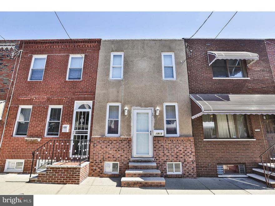 Nestled away on a quiet street in Passyunk Square, this 2 bedroom, 1 bathroom house boasts location in one of the city's most desirable neighborhoods, an updated bathroom, and a partially-finished basement! Enter into an open first floor plan with hardwood floors and recessed lighting and a charming eat-in kitchen that features hardwood cabinetry with plenty of space for storage. Upstairs you'll find a newly-updated bathroom and two bedrooms with neutral carpeting. Downstairs, a partially-finished basement hosts additional space for living, full laundry, and additional storage space. A rear patio offers spaces for summer barbecues and dining al fresco! Located in one of the city's most exciting neighborhoods, you'll be steps away from Stargazy, Chhaya Cafe, Cantina Los Caballitos, and other East Passyunk Ave restaurants and shops. With easy access to Delaware Ave, I-76, and I-95, this is the perfect place to call your own!