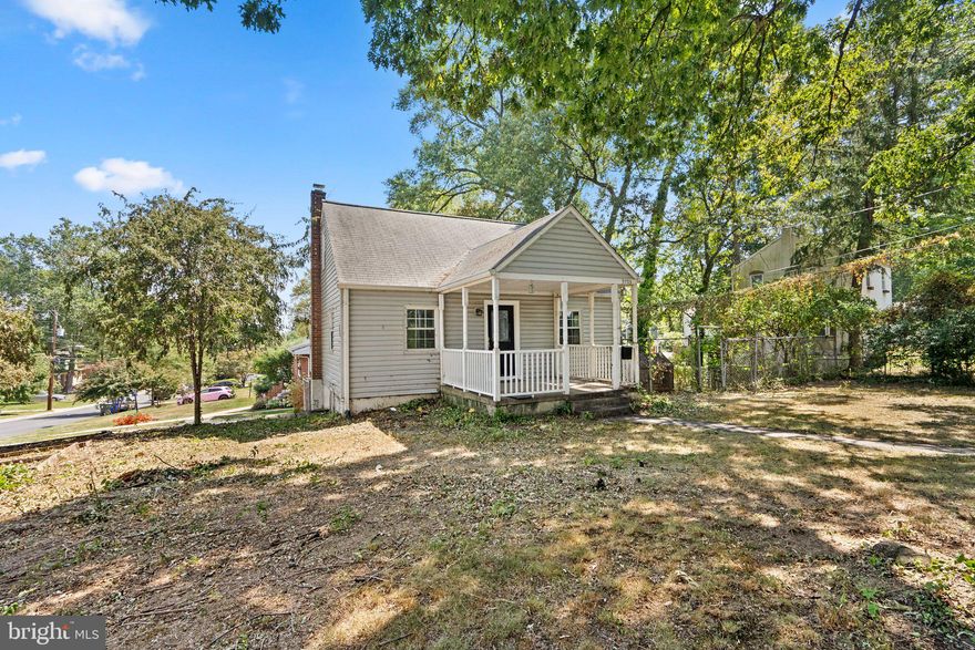 Don't miss this bright and airy 4 bedroom/2 bath home that is minutes to the Beltway and Metro!  Hardwood floors throughout!  The main floor boasts a spacious living area, kitchen with stainless steel appliances, a sunroom, a full bath, and a huge owner's bedroom.  The upper level provides a perfect home office space, as well as another bedroom.  On the lower level, there is a rec room, full bath, and two more bedrooms.  The lower level has its own private ground level entrance and parking, and could be perfect as a 2 bedroom rental.  Tons of street parking - no permit required.