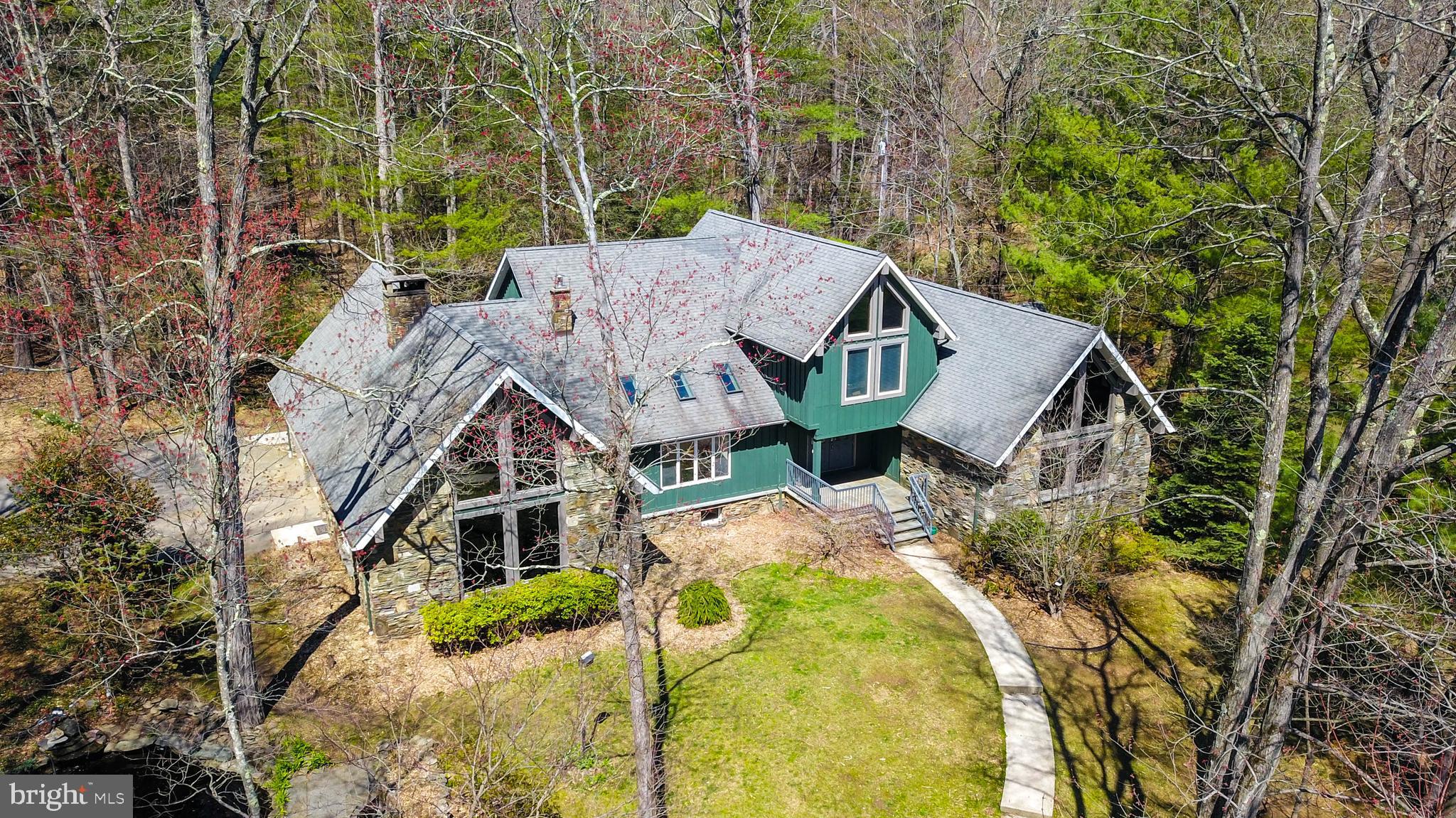 Hurry & make this farm yours today! This spectacular property boasts 52 acres of land w/ pastures, outbuildings for animals & storage, & a warm & welcoming 5-BR home. Everywhere you look are amazing view of clean woods, rolling pastures, & gorgeous skylines. This farm is perfect for the gentleman farmer but could easily be a working farm as well. So much privacy but so close to everything you need; shopping, dining, entertainment & more. Follow the winding driveway, walk past one of two ponds, into the open concept well-appointed home. A sprawling kitchen & dining space, sunken living room w/ floor to ceiling windows & huge stone fireplace. A nice back yard patio overlooking peaceful woods. An office/bedroom & full bath sit just off the kitchen. Main floor laundry. Also, the main floor has an amazing master suite w/ huge bedroom, ensuite & fully customized oversized closet. A surprising, enclosed porch w/ slate floor finishes the main floor. Upstairs to 3-4 more bedrooms & separate living space w/ private entrance. Could easily be an in-law suite. Outside find fenced pastures, a brand-new horse pasture & run-in, hay barn, shed, animal pen w/ electric fence & 2nd pond. Lots of room for horses or animals of your choice. This year 20+ acres were tilled. Too many updates to mention all! Use the land productively for income or just have your own fortress of tranquility. Low Act 319 taxes. Hard wired Cable, Cell Service. Nestled in foothills of the Poconos & easy access to NYC/NJ!