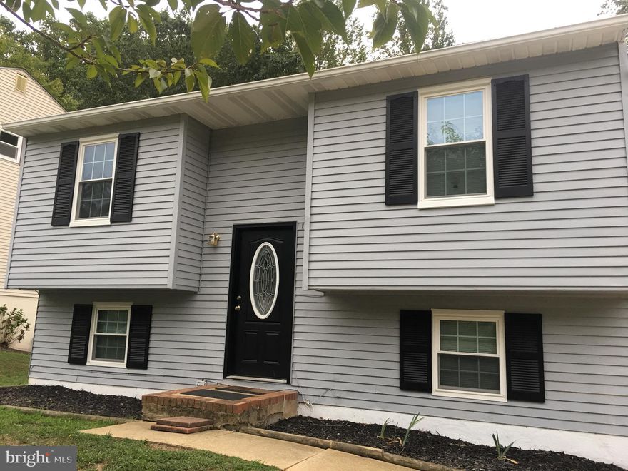 Great single family home in blue ribbon school district and the popular community of Whispering Woods! Incredibly convenient to Rte 50  and available September 15th, this 3 bedroom, 2 bath home boasts a large back yard with a beautiful, private view of the woods, a renovated kitchen with granite counter tops, stainless steel appliances, and a great deck  and slider off the kitchen! The lower level great room has an awesome wood burning fireplace for those cool fall evenings and a walk out to the large, level, partially fenced back yard.