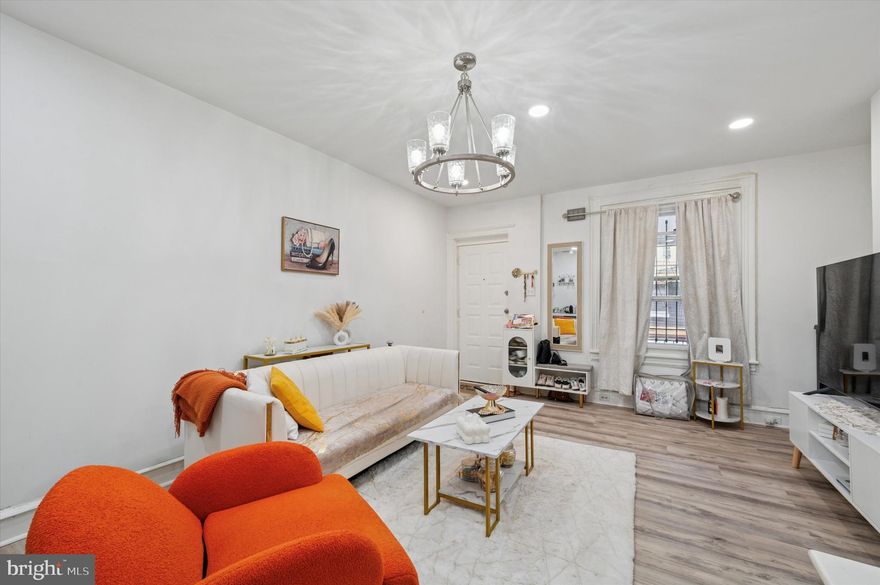 Welcome to this well-maintained townhome, offering a blend of traditional charm and modern convenience. Upon entry, you are greeted by a bright, airy living room featuring new vinyl flooring, recessed lighting, and abundant natural light from two front-facing windows. The dining room, complete with a ceiling fan and light fixture flows seamlessly from the living area. A ductless mini-split air and heat unit, strategically positioned on the dining room wall, provides efficient cooling in the summer and warmth in the winter. The kitchen leads to a cozy patio and grassy, fenced-in backyard. Upstairs, you’ll find three comfortable bedrooms, each with a ceiling fan and light fixture. The rear bedroom is enhanced with its own mini-split air and heating unit for added climate control. The recently updated bathroom features a newly installed shower and fresh tile work, offering a modern touch. This home is move-in ready and includes a 1 year America's Preferred Home Warranty Plan that covers all major systems and appliances. Don’t miss the opportunity to make this your new home. Schedule your private tour today.