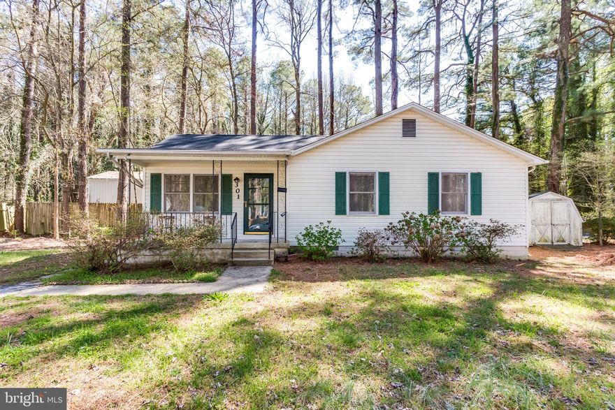 This is easy one level living in water access community of Drum Point. The 3 BR 2 BA rambler sits on a spacious corner lot nestled in pine trees. The kitchen boasts SS appliances and granite counter tops. Wood floors throughout and updated bathrooms.  The community offers many amenities such as a boat launch ramp.  Close to Solomons Island, restaurants, and shopping.