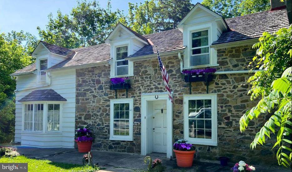 Don't miss this unique opportunity to own a versatile property with prime frontage on Route 202 and dual zoning for commercial and residential use. This charming circa 1750 Bank House offers timeless character and modern convenience, currently rented with lovely tenants who wish to stay, providing immediate rental income. The main residence features three bedrooms plus an additional office space or non-conforming bedroom, and two full bathrooms, two stone fireplaces adding warmth and historical charm, and flexible living space perfect for a family or home office setup. A separate building on the property is currently configured for commercial use and includes a new bathroom, new tankless on-demand water heater, plumbing for a kitchen and washer/dryer, offering potential for a studio, office, or live/work space, and a new septic system. Additional highlights include a garage, 10 outdoor parking spaces, and excellent visibility and access from Route 202. This property is ideal for investors, business owners, or anyone looking for a unique blend of residential comfort and commercial potential.