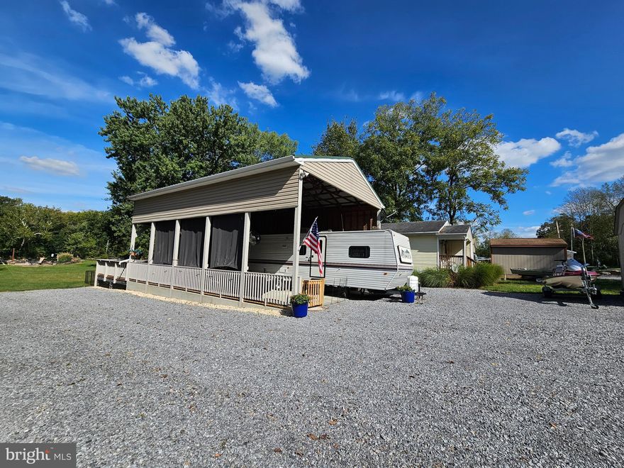 *Coming Soon* More Photos to come. 
 Tired of putting your boat in and out? Well, Look no further.

Welcome to River Front Block 139 lot 56 Boo Boo Blvd in Riverbends Rv Campground. Riverbend is 400 Acres of SEASONAL recreational campground full of amenities located on the Potomac River in Falling Waters, Wv. OPEN APRIL 1 - NOVEMBER 1 - This is a fun & entertaining community, yet relaxing. 

 This lot is stunning, beautifully maintained and located right on the Potomac River with direct access to boat, fish or just sit by the beautiful scenery. A Pontoon Dock, Catwalk, sturdy metal steps, Jet Ski Dock, and Jet ski all convey. This lot is a very large, long lot with plenty of parking, yard space for activities, concrete pad and graveled firepit area at the rivers edge and so much more.  Must walk it to appreciate the peace and joy that it brings.
A large stick-built Pavilion with a metal roof, electric, roller shades all covering a concrete pad and everything in between conveys. Including the camper, attached bunk house with a bathroom & A/C, outdoor kitchenette area with cabinets, sink, 150 Gallon holding tank, tiki bar, golf cart, riding mower and more.  
 Bring your boats, friends and water toys.

 Call today for your personal tour. Approx. 10 miles of Deep water on the Potomac River access for boating, fishing & swimming. Yearly membership ($1,987) plus a $200 initiation fee for new owners, includes water, Pump outs, electric, trash and the park amenities such as 3 pools, putt putt course, Horseshoe club, Boat club, Poker runs, Trick or Treat, Christmas in July, live bands, basketball court, tennis court, fireworks, car show, Church, restaurant, bar, convenience store (Great food), playground, volleyball, ball field and much much more. Bring your golf carts, water toys and come enjoy life!