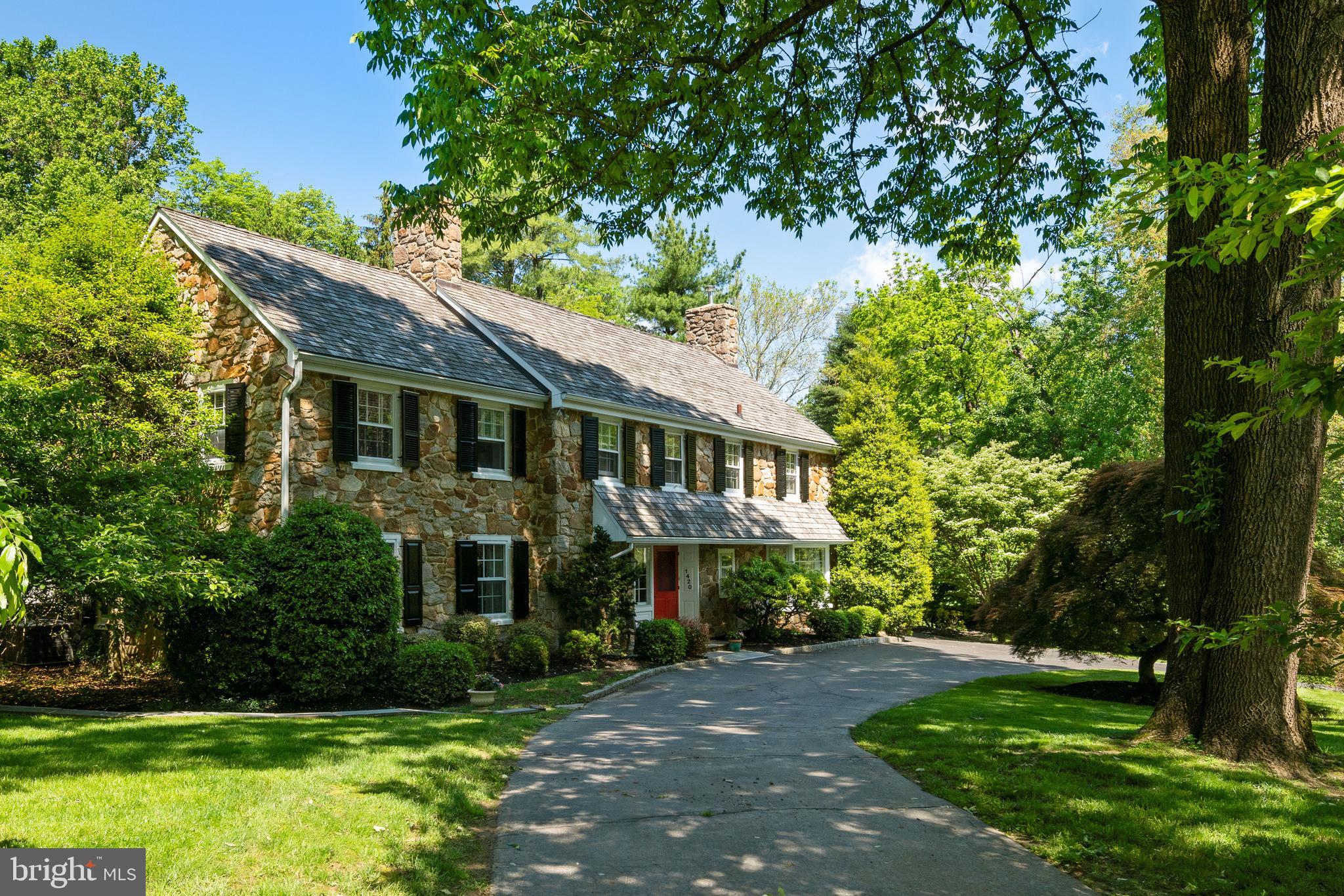 A beauty on Beaumont Drive! Situated in highly desired Gladwyne, surrounded by lush greenery and tall trees is a fabulous family home in a picture-perfect setting. Around you is .86 acres, highlighted by an outdoor oasis in the rear with a magnificent in-ground heated swimming pool, patio & pool house - the ultimate summer retreat. Lounge poolside and feel like you re at your own resort, with pristine grounds complemented by a circular drive, charming walkways, peaceful sitting areas, and blooming gardens. An enchanting stone exterior with decorative window shutters and a newer cedar shake roof (2011) create captivating curb appeal. Enter the gracious foyer into an elegant ambience and traditional Colonial-style layout with a seamless flow for entertaining. Tasteful details like random-width peg hardwood floors and classic moldings & millwork grace the refined interior. Off the foyer is a powder room and coat closet, as well as formal rooms on both sides. More intimate environs include the living room with a big bay window facing the pristine front yard, adjoining a wet bar and office area with custom built-ins and bay window. Serve meals in the wood-paneled dining room enriched by built-ins and a wood-burning fireplace. Relax with family and guests in the large family room with lovely views and gas-burning fireplace and easy access to the kitchen and great room. Also adjacent is a mudroom area with family entrance, coat closet, built-ins, back staircase & attached 2-car garage. In the rear of the hall starts an incredible addition, featuring a built-in hutch area that pours into a breathtaking vaulted, sky-lit great room and open kitchen. Here is where everyone loves to gather, sitting at the huge center island or in the spacious dining area. The chef is in heaven too with furniture-quality wood cabinetry, granite countertops, stainless steel appliances including a Wolf convection oven, microwave, warming drawer & gas cooktop, and a butler s pantry. A gas fireplace warms the sun-bathed space, brightened by oversized windows looking at the fully-fenced backyard. From the great room, you, your guests and family can access the pool patio and tiled cabana area with steam bath. The main level additionally offers a laundry room with sink, built-ins & utility fridge. Five generous bedrooms and 4 baths optimize comfort on the hardwood 2nd level. Three bedrooms are en-suite, including the divine master and spa bath with skylights, heated floors, an air-jetted tub, separate shower, double sinks & speakers throughout. One of the suites has vaulted ceilings. Two more bedrooms (one now an office) share a Jack & Jill bath. Three-zone AC cools the home in summer. All in a perfect location near top schools and all amenities!