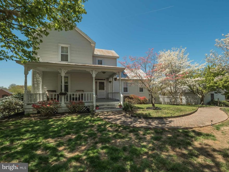 Well maintained 1920 farmhouse. This home offers the best of both old world charm and modern conveniences. This unique property with a little garden and cute guest house is Centrally located in Huntingtown Mix Use Town Center. Beautiful view from the deck. Large garage is perfect for covered parking or a workshop + a lot of extra parking. Endless possibilities! One year home warranty is included.
