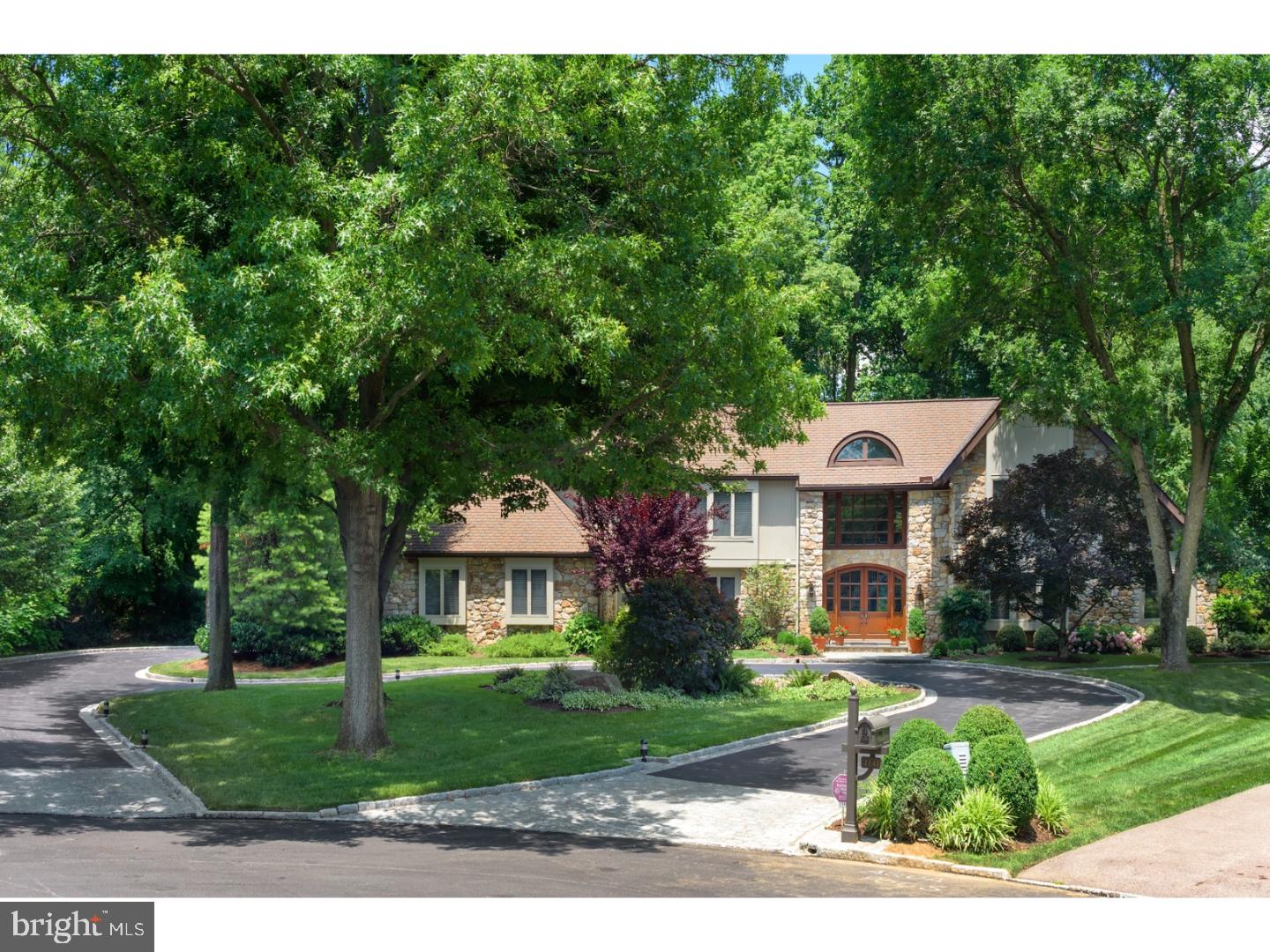Custom 5-bedroom home in Bryn Mawr at the end of a cul-de-sac with gorgeous private grounds and a beautiful pool. Two story entry hall with Australian cypress floors and curved staircase opens to office, living room,large family room and dining room. Living room boasts dramatic skylit ceiling and fireplace. Adjacent family room also has a fireplace and opens to the screened side porch with half bath conveniently located next to the pool (refurbished in 2008). The large, top-of-the-line kitchen (redone in 2009) has skylights, fabulous pantry space and an eat-in counter as well as space for a large breakfast table. The space flows seamlessly into the cozy gathering space with yet another fireplace, all with radiant heat in the floors. Not fire season? Maybe you'd like to open the glass door to the lovely screened conservatory with brick floor and vaulted ceiling that delivers you to either the back yard or driveway through one of two other doors. Two additional powder rooms and a great laundry room opening to the garage complete this level. Upstairs, you'll find a beautiful master bedroom with recently installed tray ceiling, two walk-in closets and a luxurious bath with steam shower, stunning tile work, radiant heat, hot water on demand as well as plenty of storage. The master has been connected to an adjoining bedroom currently being used as a fabulous dressing room (easy to change back). Three other large bedrooms and two hall baths as well as a large, walk-in storage closet and back stairs complete this level. The finished basement has a seating area, game area (think air hockey or pinball) and plenty of storage as well as a half bath (easily convertible to a full) and an enormous room (housing an unbelievable train display) which could easily become an extra suite. This house was virtually completely rebuilt in 2009?all new systems (converted to gas), sump pumps, roof, stucco, entryway, driveway, garage doors, pool, whole-house generators, kitchen, master bedroom and bath, hardwood, etc. It is meticulously maintained and is incredibly secluded while enjoying easy access to major roads and highways as well as Lower Merion Schools.