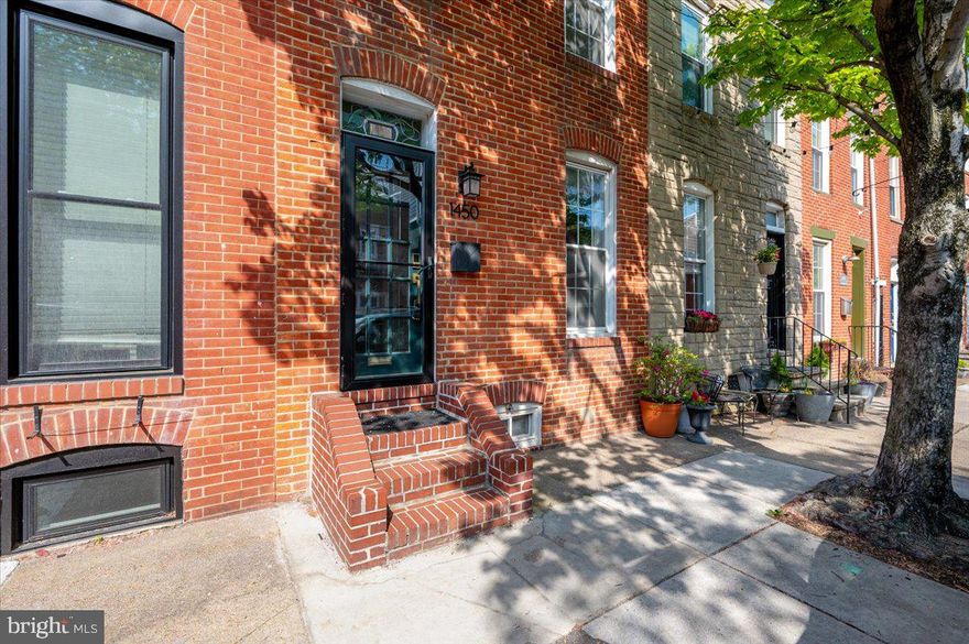 Welcome to 1450 Riverside Ave, a beautiful townhome that has the perfect combo of historic character and modern luxury. Situated on one of the neighborhood's most sought-after streets, it’s only one block from Riverside Park and less than 1.5 miles from the excitement of Camden Yards and M&T Bank Stadium. This home proves to be a savvy choice for investors or a primary resident looking for a high-value asset, earning $2,700 per month in rent. The interior shines with newly refinished hardwood floors (2026), updated recessed lighting (2023), and new carpet (2024). A spacious, modern kitchen provides a stylish and functional setting for any home chef. The primary suite has a completely renovated bathroom with dual shower heads, direct access to a premium Trex deck (2022), and top-floor laundry. The new custom storm door (2024) offers added peace of mind, while the extra-wide parking space in the rear alley provides a rare and coveted level of convenience for city living. This is a move-in-ready gem that puts the best of the city right at your doorstep.
