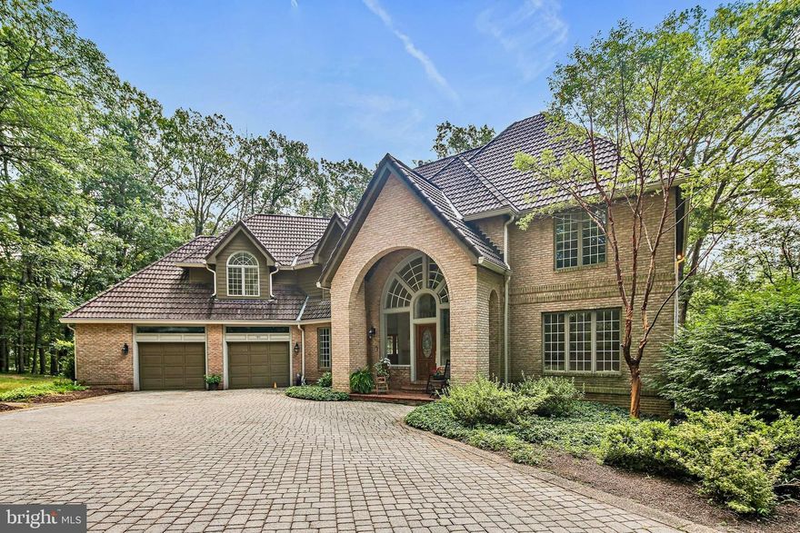 Welcome to 785 View West Drive in Westminster, MD — a showstopper of a high-end custom home, perfectly situated on 3.8 acres of beautifully wooded grounds. With over 4,000 square feet above grade and an additional 1,234 square feet below, this property offers exceptional living space both indoors and out.

Inside, you’ll find three full bathrooms and one half bath, along with a stunning primary suite that features a sitting room, two dormer window benches, a spacious walk-in closet, and a luxurious bath. The first floor showcases oak hardwoods, a library with built-ins, a coffered ceiling, and a masonry fireplace, as well as a formal dining room with a coffered ceiling and a living room with oversized crown molding. The two-story great room is a true centerpiece, complete with a masonry fireplace and a large wet bar with custom cabinetry and generous counter space. The kitchen is equally impressive, offering custom cabinetry, Corian countertops, and a Jenn-Air cooktop. A large walk-in laundry room adds to the home’s practicality, while solid oak doors, oversized baseboards, and custom trim details add timeless elegance throughout. Upstairs, there are two spacious bedrooms in addition to the primary suite, while the lower level offers two more bedrooms, a full bath, a club room with a wood stove, and a bar/entertainment area. There’s also a rough-in for a second lower-level bathroom. Comfort and convenience are ensured with oil heat, heat pumps, central A/C, a whole-house sound system, intercom, and central vacuum.

The exterior is equally spectacular, with a three-car oversized garage, a brick paver driveway and parking area, multiple brick paver patios with retaining walls, and a terracotta tile roof accented with standing seam metal. Outdoor recreation and relaxation abound with a beautiful in-ground pool surrounded by bluestone coping, brick and wood decking, and stone retaining walls, as well as a basketball court. This wooded homesite offers a tranquil , very private setting — your own personal retreat.

This is more than just a home — it’s a lifestyle. Schedule your showing today!