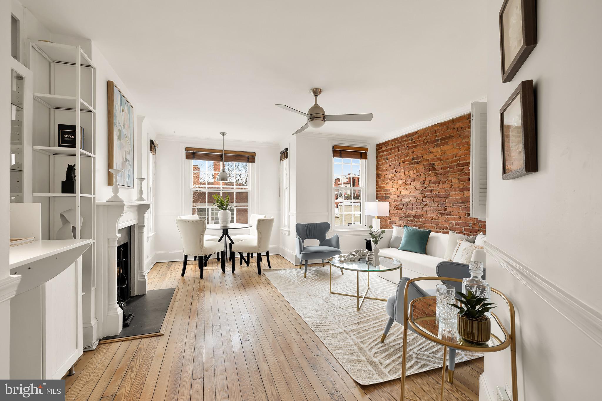 This exceptional 2-bedroom, 1-bathroom Penthouse level condo seamlessly blends original charm with modern updates in historic Dupont Circle. The bright, open living space features a large bay window, wood-burning fireplace, exposed brick, and beautiful hardwood floors. The updated kitchen boasts stainless steel appliances and granite countertops. The second bedroom offers flexibility for guests, a home office, or additional living space, while the primary bedroom provides direct access to a spacious private roof deck. The renovated bathroom is highlighted by a skylight, modern fixtures, and a sleek glass tile shower. Sky lights and extra storage with one parking spot will convey.
Nestled on a quiet, tree-lined street, 1823 Riggs Place offers the perfect balance of tranquility and city convenience. Just minutes from Dupont Circle and the Red Line Metro, this home provides easy access to top restaurants, cafes, and shops while offering a peaceful retreat from the energy of the city.