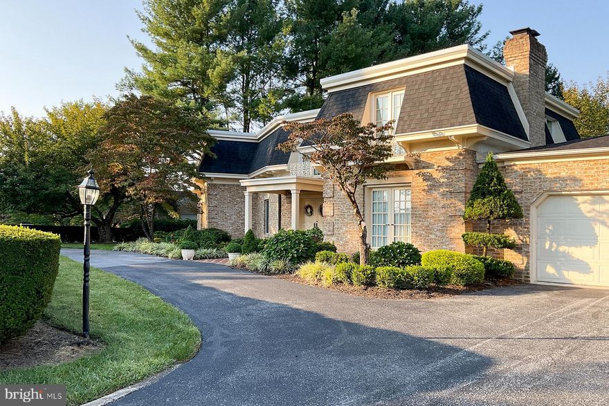 Stunning French Colonial in sought after Spring Valley!  Truly a must see.   4,990 +/- sq ft! Step into this elegant home through a grand marble foyer with a sweeping staircase that sets the tone for luxury living. The spacious floor plan features a stately living room accented with classic pillars, and a formal dining room complete with custom built-in china cabinets and a charming window seat. The gourmet kitchen is a chef’s dream, boasting stainless steel appliances, a large granite island, custom cabinetry, pantry, and a gas stove. A sun-filled sunroom, with oversized windows and French doors, opens to a vast brick patio perfect for outdoor entertaining. Ride the two-person elevator to the luxurious primary suite, featuring two large closets and a private dressing room. The upper level also includes three additional generously sized bedrooms and two full baths. On the main level, enjoy the cozy family room with custom cabinetry and a grand fireplace, along with the convenience of a first-floor laundry room, storage, and a second half bath. The oversized two-car garage offers plenty of space for vehicles and more. The finished lower level is designed for entertainment and relaxation, with a spacious game room complete with a fireplace and bar, an exercise room, cedar closet, wine room with custom storage, and plenty of extra storage with built-in shelving. This meticulously maintained one-owner home feels like a model and is move-in ready! Economical gas heat!