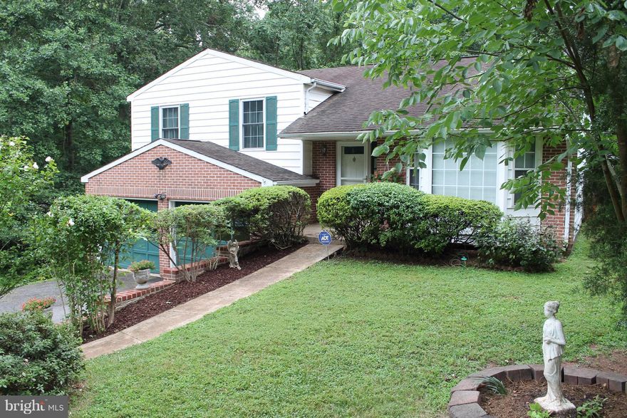 This is a find! Lovely split level home with lots of light, large open kitchen with eat in dining on upper level and living room at entry level.  Nice neighborhood, nestled around trees with lots of privacy on .92 acres.  2 car garage, No HOA!, Home Warranty included.  Close to major routes and VRE. This property is being Sold AS-IS