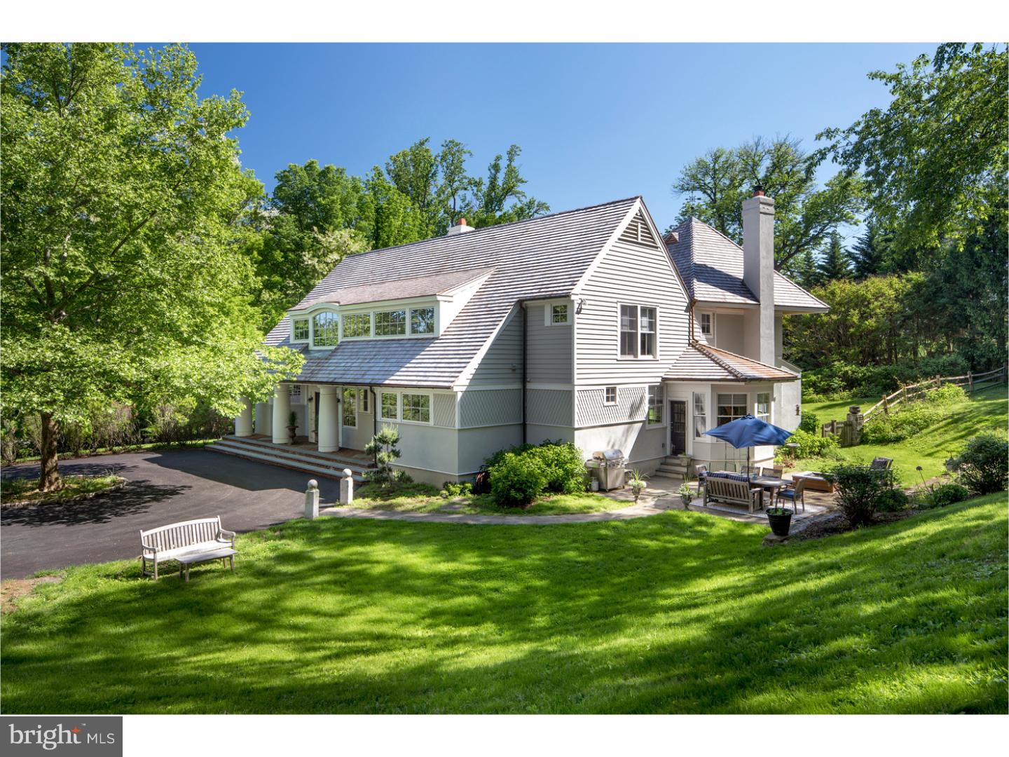 An ethereal 2 acres of bucolic, beautifully landscaped property surrounds this stunning Main Line country estate designed by the preeminent John Fox Hayes, Jr. and Ed Mahoney. The private environs and premier cul-de-sac location are truly captivating, with a long elegant drive lined with lovely trees that take on the colors of the changing seasons. Fronted by a circular drive, and greeting you with an open covered porch with stately columns, this exquisite 5/6 bedroom home in an ultra-desirable enclave of Radnor Township offers an exceptionally comfortableupscale lifestyle. Right on your grounds you can enjoy the blissfulness of an in-ground pool and hot tub, as well as extensive lawn area for all to play, and outdoor patios for parties and barbecues providing a special slice of heaven. The thoughtfully laid out, impeccably finished interior is a perfect backdrop for hosting guests and family occasions you will remember for years to come. Sophisticated details abound throughout and add to the allure, such as cathedral/vaulted ceilings, open archways, finished wood, stone and carpeted floors, tasteful moldings, and high-end fixtures, appliances and systems. The expansive open floor plan is filled with generous natural light and seamlessly facilitates comfortable living and entertaining. Lovely fireplaces grace both the living room/great room and the family, adding warmth and charm. The chef's kitchen is inspiring, with premium appliances, a center island, pantry, and sunny breakfast room for morning coffee and snacks. A study/library surrounded with bookshelves is a perfect spot to read. The upper level presents 4 spacious bedrooms and 3 full baths, including a wonderful master suite with a walk-in closet and spa-style bath. The large 2nd story of the detached 3-car garage (with heating and AC) adds the potential of making this a 5/6 bedroom house with many possibilities for the space including an in-law suite, guest suite, even a private office or gym. Other highlights of this pristinely maintained home include a 1st floor powder room and mud room, 2nd floor laundry room and rear balcony, finished basement, attic storage, central vacuum, central air, a security system,and new cedar shake roof. Minutes away is Downtown Wayne, King of Prussia Mall, great restaurants, award-winning schools, and all major transportation routes!