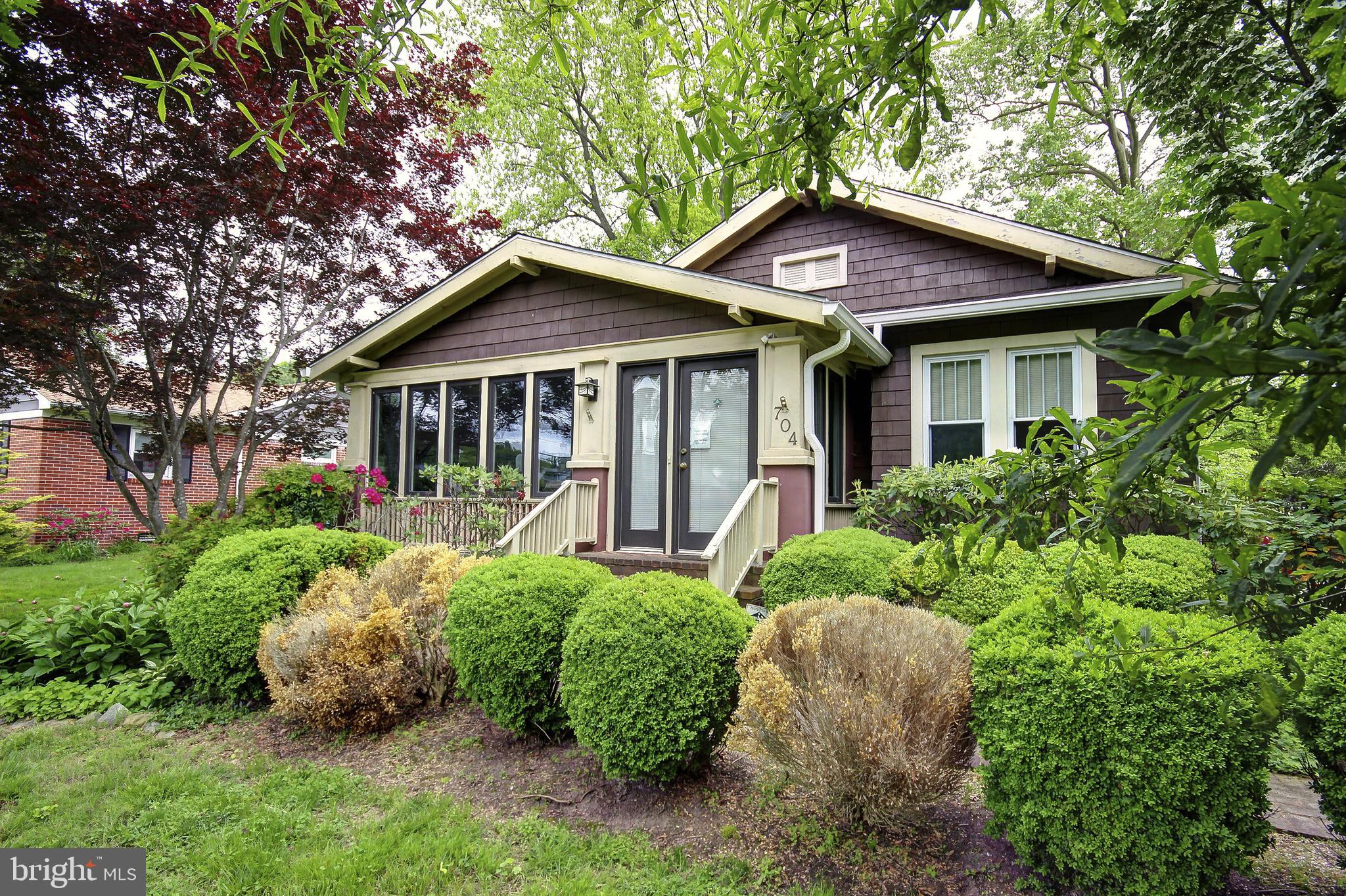 Step into the charm of yesteryear with this delightful 1926 Craftsman home, where timeless character meets thoughtful updates. From the moment you walk through the door, you’ll be greeted by rich original hardwood floors, classic built-ins, elegant crown molding, and all the little details that speak to the craftsmanship of a bygone era.
The heart of the home features an inviting living room with a cozy fireplace that flows effortlessly into the dining room—perfect for gathering with family and friends. The kitchen is thoughtfully designed with sleek stainless steel appliances that bring a modern touch to this warm, inviting space—perfect for everyday meals or entertaining loved ones. A large, light-filled front sunroom provides even more space to relax, unwind, or get creative.
Outside, enjoy the serene fenced backyard with a charming gazebo and low-maintenance composite deck—ideal for summer evenings and weekend get-togethers. A spacious basement adds the perfect finishing touch to this charming home, offering endless possibilities. Need a little more room to dream? The detached one-car garage is currently a functional gun shop, but it could easily become your next workshop, studio, or simply serve as a classic garage once again.
As a unique bonus, this property includes an additional .12-acre lot with its own address—105 Hope Rd—bringing the total lot size to an expansive .39 acres. Whether you're thinking of expanding, gardening, building, or simply enjoying the extra space, this rare opportunity offers flexibility and potential that's hard to find.
With a new roof, HVAC system, and rear deck all added within the last three years, this home blends historic beauty with modern comfort. Located in historic Centreville, you're just moments from local shops, dining, and convenient access to Route 301. Don’t miss the chance to make this house your home! Schedule your private tour today!