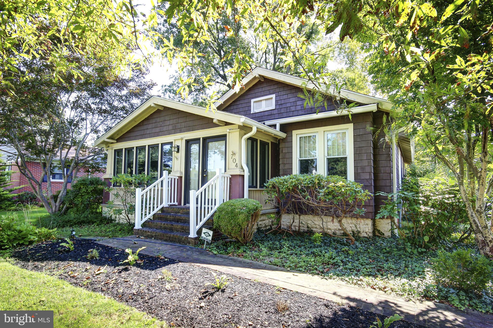 ** LISTED BELOW APPRAISED VALUE, REDUCED FOR QUICKER SALE ** Step into the charm of yesteryear with this delightful 1926 Craftsman home, where timeless character meets thoughtful updates. From the moment you walk through the door, you’ll be greeted by rich original hardwood floors, classic built-ins, elegant crown molding, and all the little details that speak to the craftsmanship of a bygone era.
The heart of the home features an inviting living room with a cozy fireplace that flows effortlessly into the dining room—perfect for gathering with family and friends. The kitchen is thoughtfully designed with sleek stainless steel appliances that bring a modern touch to this warm, inviting space—perfect for everyday meals or entertaining loved ones. A large, light-filled front sunroom provides even more space to relax, unwind, or get creative.
Outside, enjoy the serene fenced backyard with a charming gazebo and low-maintenance composite deck—ideal for summer evenings and weekend get-togethers. A spacious basement adds the perfect finishing touch to this charming home, offering endless possibilities. Need a little more room to dream? The detached one-car garage is currently a functional gun shop, but it could easily become your next workshop, studio, or simply serve as a classic garage once again.
As a unique bonus, this property includes an additional .12-acre lot with its own address—105 Hope Rd—bringing the total lot size to an expansive .39 acres. Whether you're thinking of expanding, gardening, building, or simply enjoying the extra space, this rare opportunity offers flexibility and potential that's hard to find.
With a new roof, HVAC system, and rear deck all added within the last three years, this home blends historic beauty with modern comfort. Located in historic Centreville, you're just moments from local shops, dining, and convenient access to Route 301. Don’t miss the chance to make this house your home! Schedule your private tour today!