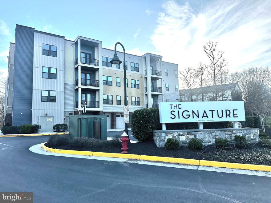 Welcome to effortless, elegant living at The Signature at Broadlands — one of Loudoun County's most sought-after active adult (55+) communities! Stunning and modern 3-bedroom 2 full bath condo with den checks every box — 1,712 square feet of open concept living, a private single-car garage with driveway space for additional vehicle in a secure elevator building.

Showstopping kitchen features granite counters, stainless steel appliances, a double oven, and an island countertop with space for sitting and chatting while the cook prepares something delicious.   Cozy up by the fireplace in the living room or step out onto the private balcony for some fresh air.   Separate laundry room.

As part of the Broadlands HOA, enjoy pools, pickleball and tennis courts, a nature center, walking trails and more — plus convenient access to shopping, dining, and major commuter routes. Low-maintenance luxury living at its finest.