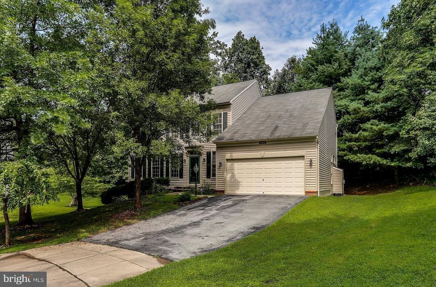 Must see 2-car garage colonial on a prime cul-de-sac lot backing to trees! Eat-in kitchen w/double wall oven, gas cooktop & island. Sunken family rm w/gas fireplace. MBR w/cathedral ceiling & double walk-in closets. MBA w/soaking tub, separate shower & double vanities. Upper lvl laundry. Finished lower lvl w/rec rm, full bath & walk-up to rear patio / deck. A tremendous value in Ellicott  City!