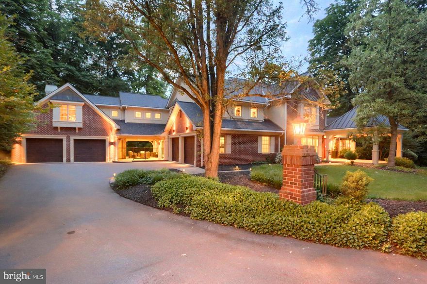 Welcome to The Cliffs, where exceptional craftsmanship and thoughtful upgrades create an unparalleled living experience. The grand foyer beneath a sparkling chandelier sets a luxurious tone. The formal living room welcomes guests with elegance, while the tranquil home office offers a productive space bathed in natural light from the large bay windows.

The main level shines with one-of-a-kind details. The half bath features a golden hexagon mosaic tile backsplash and a stacked stone veneer accent wall—adding texture and sophistication. 
The kitchen is designed for both beauty and function. Highlights include a cozy gas fireplace, custom hand-glazed cabinetry with built-in lighting, gas range, Sub-Zero refrigerator, dishwasher, built-in microwave, and a coffee bar. Nearby, the formal dining room sets the stage for memorable dinners. The sun-filled piano room, wrapped in bay windows, and the impressive bar room with vaulted ceilings offer inviting spaces to relax or entertain.
The media room, easily accessed from the driveway entrance, provides a flexible and convenient space for movie nights or gatherings.
Venture to the lower level through the bar room, where in-law quarters provide a private retreat, complete with a living room, fireplace, kitchen with a dishwasher, and halogen flattop.
The primary bedroom is a luxurious ensuite with a full bath, while the office is spacious and positioned near a convenient laundry area. Perfect for guests or multigenerational living.
From the foyer, ascend the sophisticated curved staircase, adorned with wrought iron and hardwood railings, bringing architectural grace to the upper level leading you to the four additional ensuite bedrooms, each with walk-in closets.
The primary suite is a masterpiece, highlighted by a stone fireplace, coffered ceilings, and tray-inlays, creating a truly opulent atmosphere. The primary bath indulges with a jacuzzi tub, dual vanity, marble flooring, gas fireplace, dual walk-in shower, and an extravagant custom carpeted walk-in closet adjacent to the laundry room.
The gym room is designed with a fireplace and can easily be transformed into a guest suite. Just outside the gym, a stairway leads to the grand patio, also accessible from the bar room. Perfect for entertaining, this outdoor space offers ample room for large gatherings, while a beautiful small creek lined with natural stone provides a serene setting. You will love the natural stones found leading the way to the patio stairs. 
This immaculate residence features a newer architectural shingle roof, has been converted from oil to propane, offering 8 independent heating zones, each managed by Nest smart thermostats for ultimate climate control and energy efficiency. Every detail of this extraordinary home reflects elegance, craftsmanship, and thoughtful design. Don't miss the opportunity to own a residence that defines luxury living at The Cliffs!