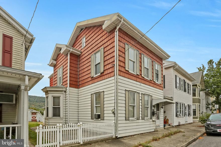 Investors or Handy Buyers- Bring your ideas today and upgrade this large Boro home today.   With some sweat equity, this home's curb appeal will radiate again.  3 beds upstairs, large living room, dining room and open kitchen and a half bath.  Above has 3 beds and one full bath in need of rehab.  The outside space is easy to maintain and appealing with a fenced exterior that has walkways that lead to the rear with a great, oversized 2 car bank garage, equipped with easy access to park from back alley in the garage or up the shared paved drive to back of house.  The garage is equipped with an upper workshop to work on projects or would be great for storage and equipped with shop vac and electric garage doors.  Sold AS-IS, conventional rehab, investment portfolio loans, or cash only.  Property is suited for a great winter rehab project, handyman special, or future rental with property management services available.   Call today to schedule your private showing!