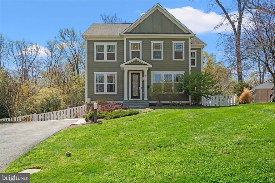 Welcome to 8112 Wingfield Pl in peaceful Hollin Hall. This home was built brand new from the ground up by renowned builders Stanley Martin. With over 4,600 sqft of living space, this 5br/4.5ba Craftsman style home offers a light filled open floor plan on three finished levels. Sitting on an 11,000+ sqft lot, enjoy the privacy of a cul-de-sac and the serenity of backing up to trees & parkland. When entering the home, you are greeted by high ceilings & warm hard wood floors. The separate private office with custom built-ins is perfect for WFH. The large separate dining room allows you to entertain large parties of friends and/or family dinners. Off the DR, there is a butler's pantry with stainless under counter refrigerator, sink & extra shelving. This connects to the mudroom with custom built-in shoe cubbies, drawers & coat racks. The airy family room with gas fireplace blends seamlessly into your custom kitchen with large island + bar, ample cabinetry, quartz counters & stainless steel appliances. Leading out to your composite built deck with awning you will find a gorgeous in-ground pool with a built in retractable cover for your convenience & a mounted outdoor TV for added entertainment. Semi finished space under the deck acts like a large storage shed, great for all your yard & pool equipment  (including filter housing and pump).  Other outdoor spaces include a wonderful custom circular patio great for entertaining around a cozy fire pit. The walk out lower level offers large family room with full second kitchen boasting custom cabinetry, quartz counters, & full size stainless steel appliances. Large exercise room can double as a yoga studio or gym. You will also find a full bedroom with full bath. The lower level is a perfect space for any guests, family or au pair. In addition, the lower level set up allows for a rentable living space with separate entrance. The upper level provides spacious primary suite that offers it all- en suite bathroom with walk in shower & soaking tub plus a a walk in closet with shelf systems perfect for any size wardrobe. Two large bedrooms share a Jack & Jill bathroom with double vanity & the fourth bedroom enjoys its own en suite bathroom. Other features include tall windows, tall doors, recessed lighting throughout, two separate 50 gallon water heaters, high efficiency Trane HVAC system with separate zones, two 200 amp electric service panels, full exterior irrigation system & a dual Tesla charger! This home truly has it all. Minutes from the Potomac river & GW Parkway with its wooded trails. Easy access to Old Town, Washington DC & Fort Belvoir.