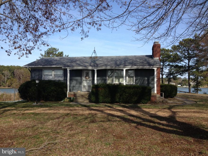 25K reduction!! Great opportunity to own two acres on St Jeromes Creek. Rambler on a full basement with 2BDRs, 1 full bath. Original hardwood throughout main level. Basement has FR and workshop.  Large screen porch on rear of home, perfect for enjoying the waterview.  100 ft Pier has power and water along with boat lift. Mean low water is over 4ft. Great for large boats. Estate sale Sold as-is.