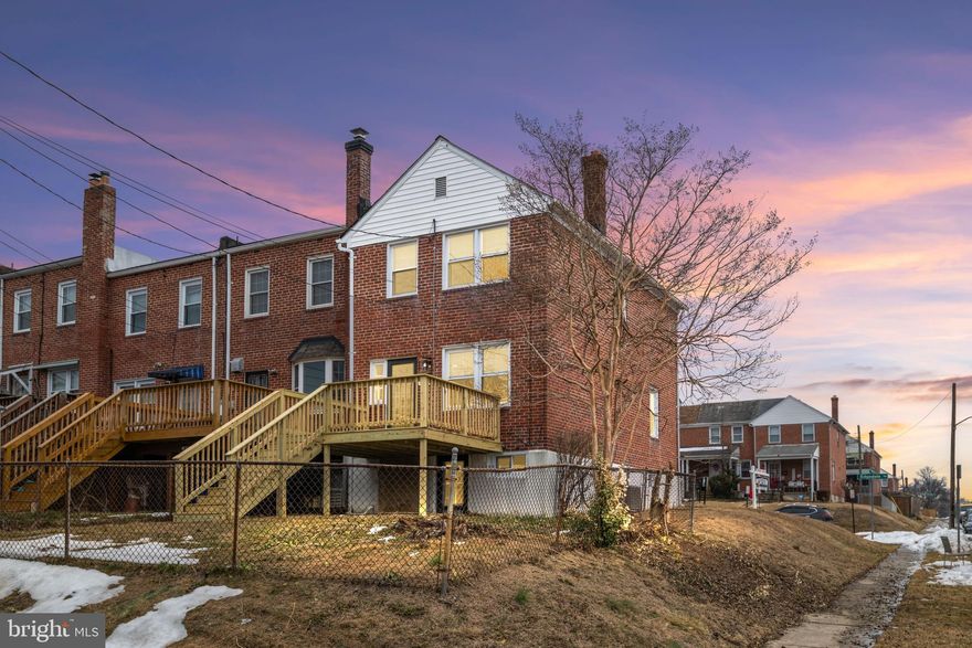 Completely remodeled and move-in ready! This 3-Bedroom, 1.5-Bath End-of-Group brick-front rowhome offers the perfect blend of classic charm and modern upgrades in a convenient Parkville location.

The inviting covered front porch welcomes you into a bright and beautifully updated interior where newly refinished hardwood floors and abundant natural light immediately capture your attention. Freshly painted throughout and featuring all new windows, this home feels crisp, clean, and ready for its next owner.

The fully renovated kitchen is a true standout, showcasing brand-new stainless-steel appliances including a gas range, quartz countertops, undermount sink, subway tile backsplash, recessed lighting, and a center island with storage and bar stool seating. A large pantry and all-new soft-close cabinetry provide exceptional storage. Just off the kitchen, step onto the brand-new walk-down deck overlooking the fenced backyard—perfect for entertaining or relaxing outdoors.

Upstairs, you’ll find three bedrooms, each offering refinished hardwood floors, fresh paint, new windows, and updated light fixtures. The full bath has been completely renovated with a new tub, subway tile shower surround, new vanity, updated fixtures, and a new dual-flush toilet. A convenient linen closet completes the upper level.

The partially finished walk-out basement expands your living space and is ideal for entertaining, a home office, or recreation area. It features new carpet on the stairs, waterproof and scratch-resistant luxury vinyl plank flooring, recessed lighting, fresh paint, two new windows, and new interior doors. A convenient half bath includes a new vanity and dual-flush toilet. The rear utility room offers ample storage and includes a new sump pump, new laundry tub, and freshly painted floor.

Additional updates include a brand-new central air conditioning system, furnace (2012), water heater (2019), new smoke detectors, a coat closet in the living room, and luxury vinyl plank flooring in both the kitchen and upper-level bath.

Conveniently located near shopping, dining, entertainment, and major commuter routes, this home is an excellent opportunity for a first-time buyer or anyone seeking low-maintenance living with modern updates.

Check out the 3D virtual tour and schedule your exclusive showing today!