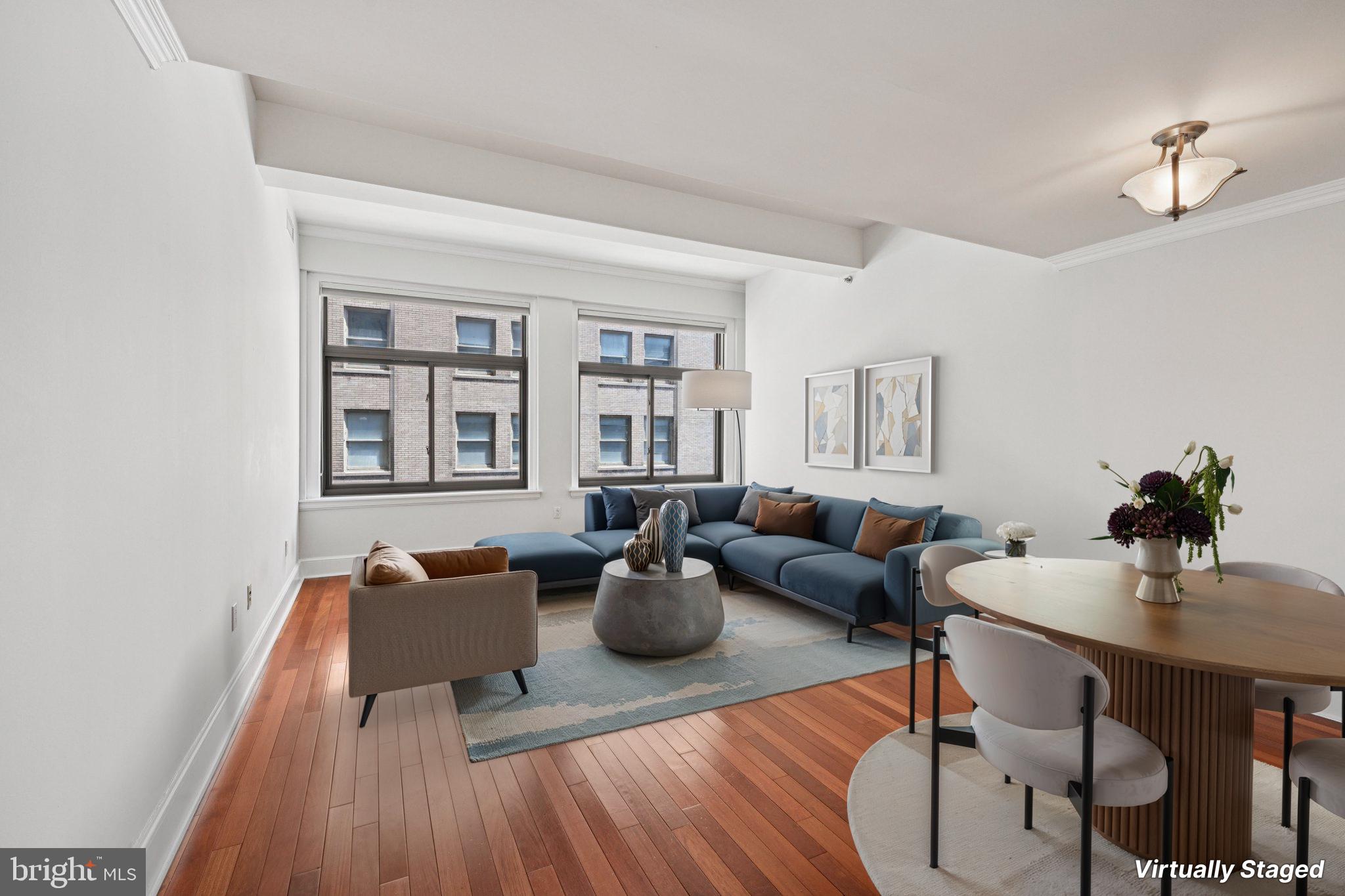 Move-in ready and impeccably appointed, this stunning one-bedroom residence at The Ellington offers an elevated lifestyle in the heart of the city. The main living and dining area showcases gleaming hardwood floors, soaring ceilings, and oversized windows that flood the space with natural light—creating a warm and airy ambiance ideal for both relaxing and entertaining. The gourmet kitchen is outfitted with premium finishes, including sleek granite surfaces, stainless steel appliances, and high-end cabinetry. A spacious bedroom provides excellent closet space and a serene retreat from the urban energy. The beautifully finished bathroom features luxurious materials and a refined design. Residents of The Ellington enjoy a meticulously maintained building with exceptional staff and top-tier amenities. A true turnkey opportunity for upscale city living.