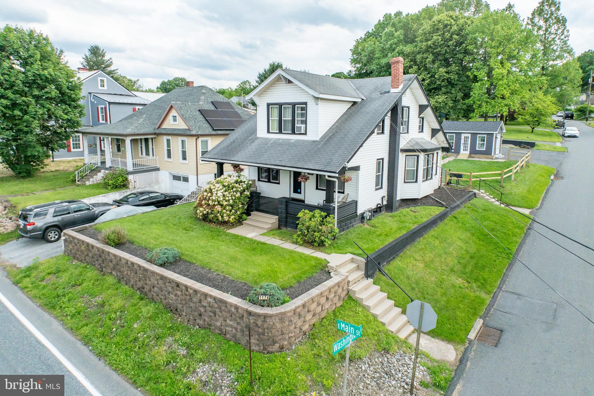 Welcome to this beautifully renovated Craftsman-style home, where timeless character meets thoughtful upgrades throughout. Featuring a brand-new roof to be completed before settlement, this home is truly move-in ready. A spacious driveway offers ample parking, leading to a fully fenced backyard that's ideal for entertaining or simply unwinding. Enjoy not one but 2 sheds of which has been transformed into a stylish, climate-controlled she shed or man cave, complete with a mini-split system. The backyard includes a lovely stone patio perfect for outdoor gatherings. Step into the enclosed porch filled with natural light from abundant windows. This inviting space showcases new flooring throughout and recessed lighting, setting the tone for the rest of the home. The updated kitchen features classic white cabinetry with modern hardware, durable tile flooring, attractive butcher block countertops, a sleek undermount sink, and a full suite of stainless appliances- including a dishwasher, refrigerator, electric oven, and a built-in microwave. A ceiling fan completes the space for added comfort. The adjacent dining room is bright and cheerful, enhanced by a charming window nook with a built-in window seat that opens for storage, chair rail, and an elegant chandelier complete the room. The expansive living room offers plenty of space to relax or entertain, featuring the same durable and attractive flooring, a cozy electric fireplace, built-in bookshelves, and a ceiling fan. Upstairs, you'll find three serene bedrooms- all with hard surface flooring, generous closets, and neutral tones to suit any style. The newly renovated full bathroom is so inviting with a large modern vanity, tub with a tiled surround and glass doors, and a sleek tiled floor. Enjoy the spacious covered front porch, perfect for sipping coffee, maybe an evening cocktail, or just chit-chatting with a friend. Full unfinished basement with laundry. Located just minutes from the Schuylkill River Trail, fantastic dining, and major commuter routes. This home offers the perfect blend of convenience and charm. Don't miss your chance to own this thoughtfully updated gem- just move in and start living!