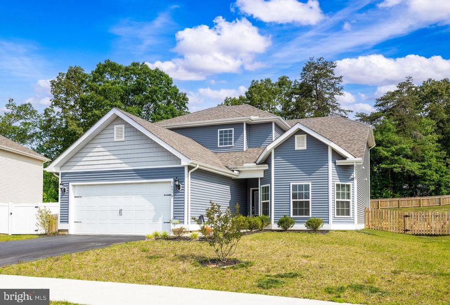 Welcome to your newly built dream home built in 2021! This pretty property features a spacious and modern design, with the primary bedroom conveniently located on the main level for easy accessibility.

As you step inside, you'll be greeted by an open and airy living area that boasts NEW 2023 carpeted floors, NEW PAINT, large windows that flood the space with natural light. The gourmet kitchen is equipped with state-of-the-art appliances, granite countertops, and an oversized L shaped counter that's perfect for entertaining guests.

The main level features a luxurious primary suite, complete with a full en suite bathroom that includes a double vanity, a soaking tub, and a separate shower. Additionally, there's a convenient half bath on the main level for your guests.

Heading upstairs, you'll find three additional bedrooms, each with ample closet space and plenty of natural light. A full bathroom with a pretty vanity and a shower/tub combo services the upper level bedrooms.

Other noteworthy features of this home include a large fenced in yard perfect for enjoying your morning coffee, a two-car garage, and a spacious laundry room.

Located in a sought after neighborhood, this property is just a short drive away from shopping, dining, and entertainment options. Don't miss your chance to own this stunning home – schedule a showing today Photos are enhanced!