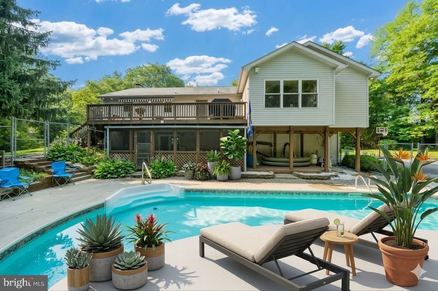 Single family home in a private oasis on a large 3.35 acre lot.  Privacy at its best.  Inground pool for your enjoyment.  Primary bedroom suite has an exceptional layout with a generous amount of closet space including a large walk-in closet in addition to 4 other closets.  Sitting room/office overlooks the pool and wooded area - very relaxing.  The primary bathroom features a built in towel warmer and other quality upgrades.  Hardwood flooring on main and lower levels.  2 wood stoves capable of heating the entire house.  Large, spacious kitchen with corian countertops, stainless steel appliances, island and a generous space for dining.  Kitchen provides access to the deck on the upper level.   The well pump was replaced 2 years ago and has a 30 year warranty.  The washing machine was purchased last year.  Don't miss this great opportunity.